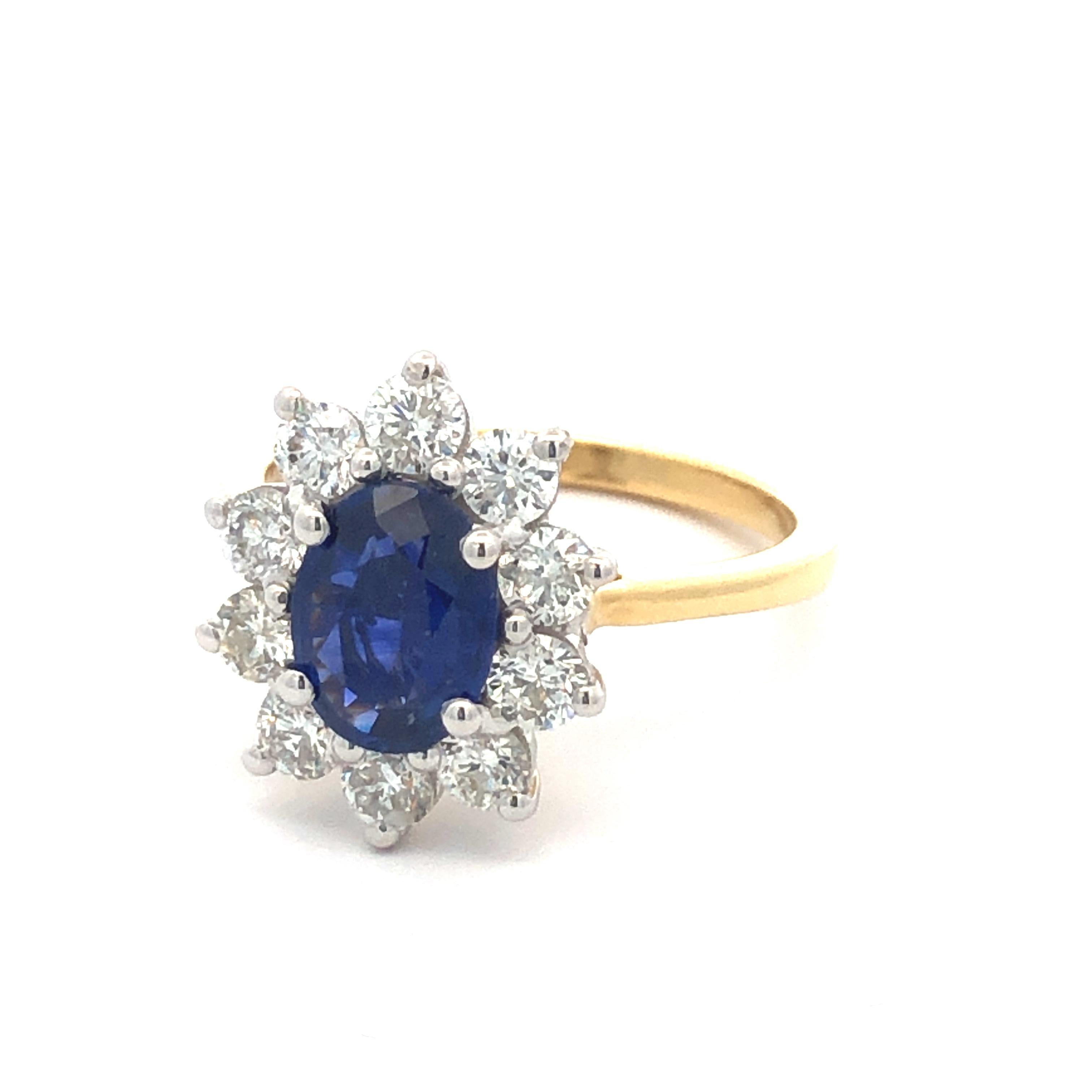 A bespoke lustrously large 2.51 carat total gem weight, having 1.50 Carat Blue Sapphire Dress / Engagement Ring surrounded by a claw set diamond halo With a total diamond weight of 1.01 carat diamonds white colour G, clarity VS / SI round brilliant