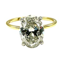 Anillo de compromiso de oro amarillo de 18 quilates y diamante brillante oval de 2,51 quilates