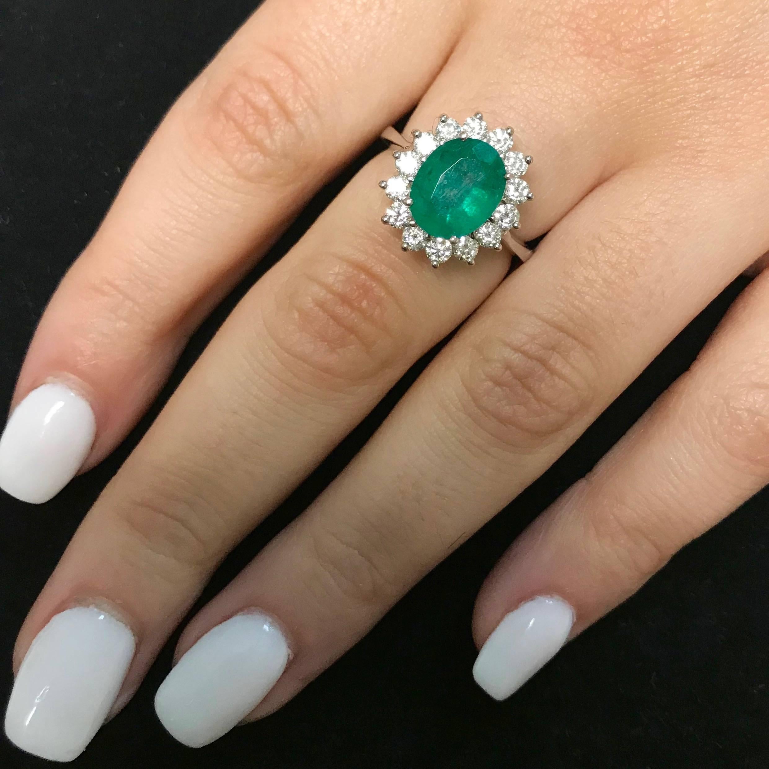 Material: 14k White Gold
Gemstones: 1 Oval Emerald at 2.51 Carats. Measuring 8 x 10 mm.
Diamonds: 14 Brilliant Round White Diamonds at 0.80 Carats. SI Clarity / H-I Color. 
Ring Size: 6.25 (Can be sized)

Fine one-of-a kind craftsmanship meets