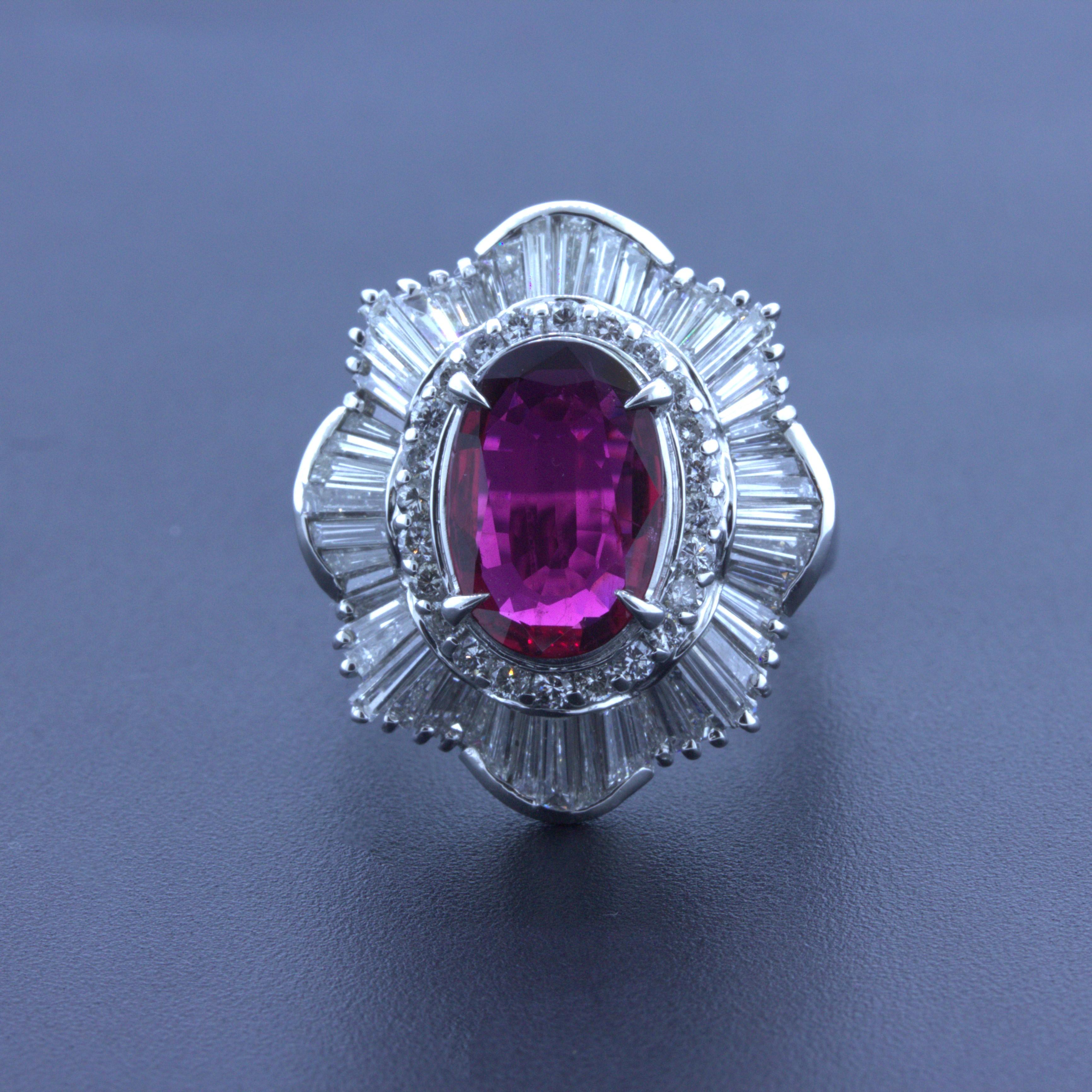A chic and classy platinum ring featuring a fine oval-shape natural ruby. It weighs 2.51 carats and has a rich intense pure red color. Adding to that, the ruby is extremely clean allowing it to shine brightly and brilliantly. It is complemented by