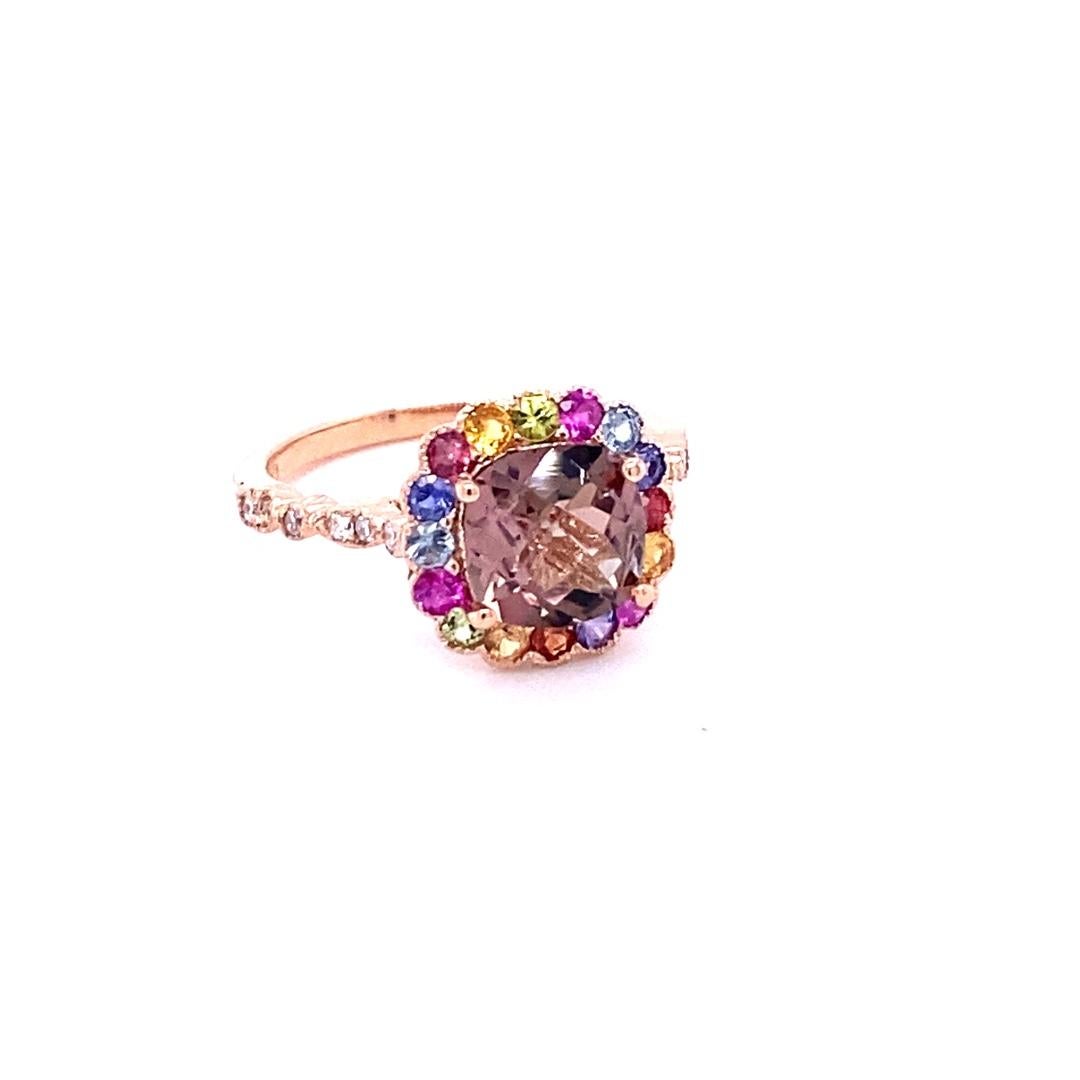 2.51 Carat Tourmaline Sapphire Diamond 14 Karat Rose Gold Cocktail Ring
Affordable! Luxury! Fine jewelry! Fashion!

This Ring has a Cushion Checkered Cut Tourmaline that weighs 1.71 Carats and 16 Multi Sapphires that weigh 0.67 Carats. There are