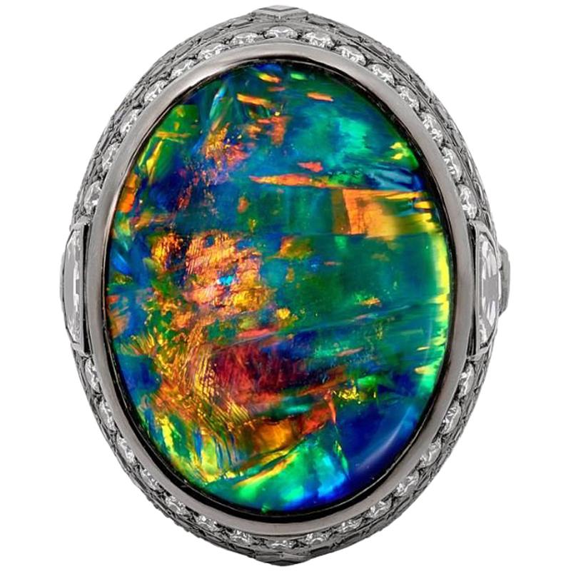 25.10 Carat Lightning Ridge Black Opal 0.97 Carat Blue Sapphires Diamond Ring For Sale