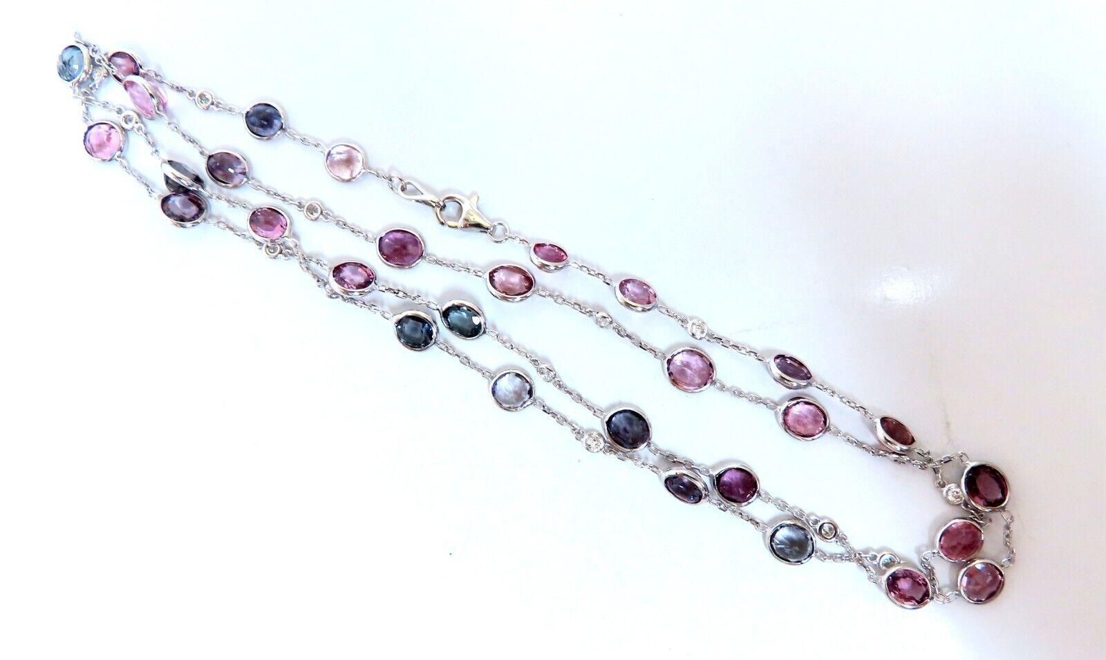 Natural spinel diamonds yard necklace.

Ranging colors: pink, greens, red, purple, blue, and teal.

Ovals cuts.

Average each 5x4 mm

Clean Clarity brilliant cuts

.45 carat natural round diamonds

G color vs2 clarity

14 karat white gold

11