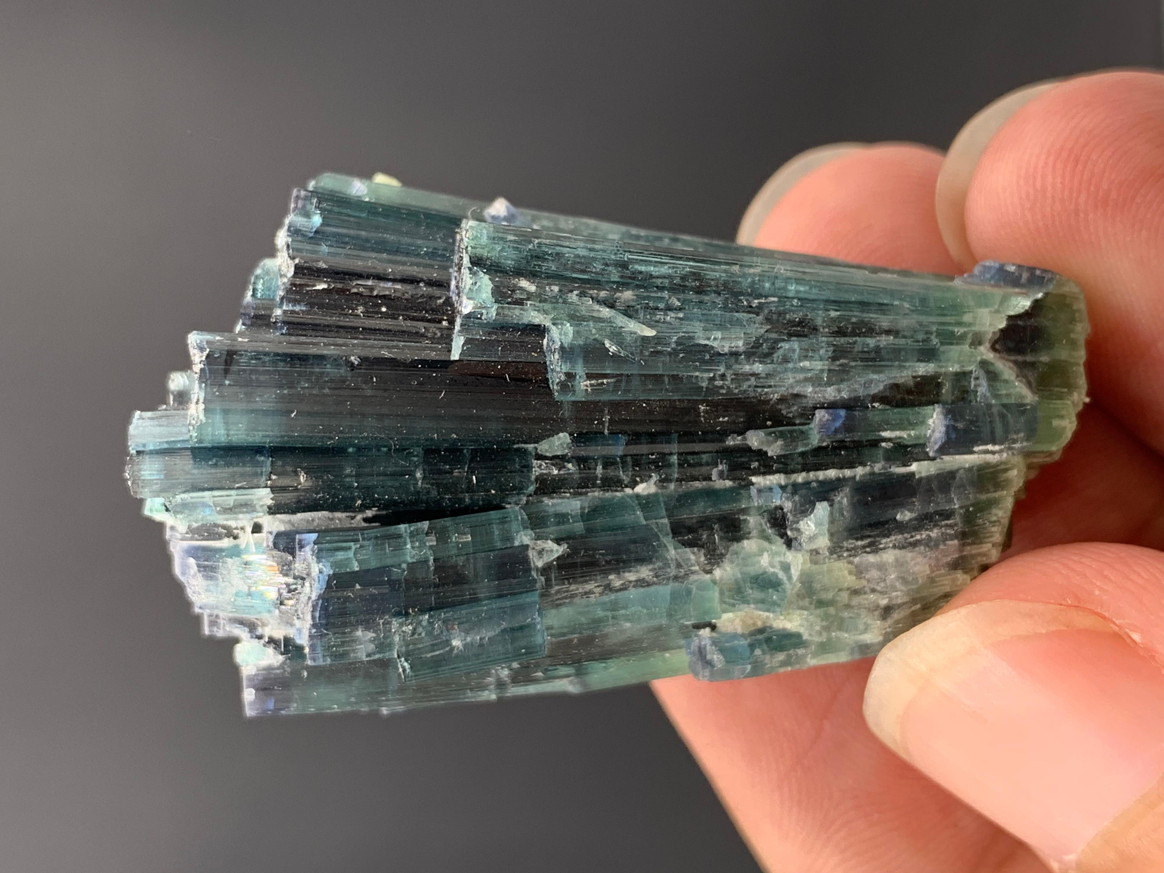 25.15 Gram Amazing Indicolite Blue Tourmaline Cluster From Kunar, Afghanistan 
Weight: 25.15 Gram 
Dimension : 4.4 x 2.6 x 1.4 cm
Origin: Kunar, Afghanistan 

Tourmaline is a crystalline silicate mineral group in which boron is compounded with