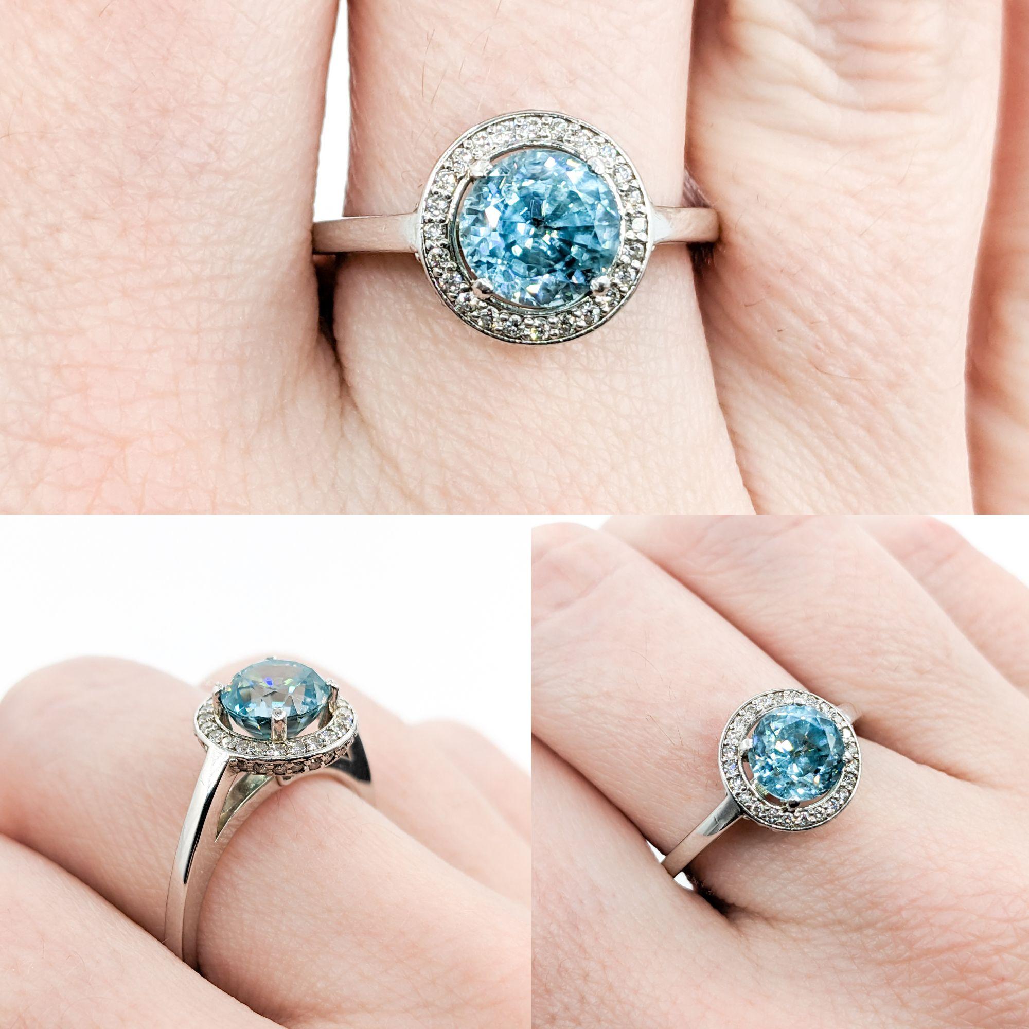 2.51ct Blue Zircon & Diamond Halo Ring In White Gold

Introducing our stunning Blue Zircon and Diamond Ring, exquisitely crafted in bright 14k white gold. This ring features a breathtaking 2.51ct blue zircon, adding a captivating splash of color.  