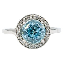 Bague halo de zircon bleu 2,51 carats et diamants en or blanc