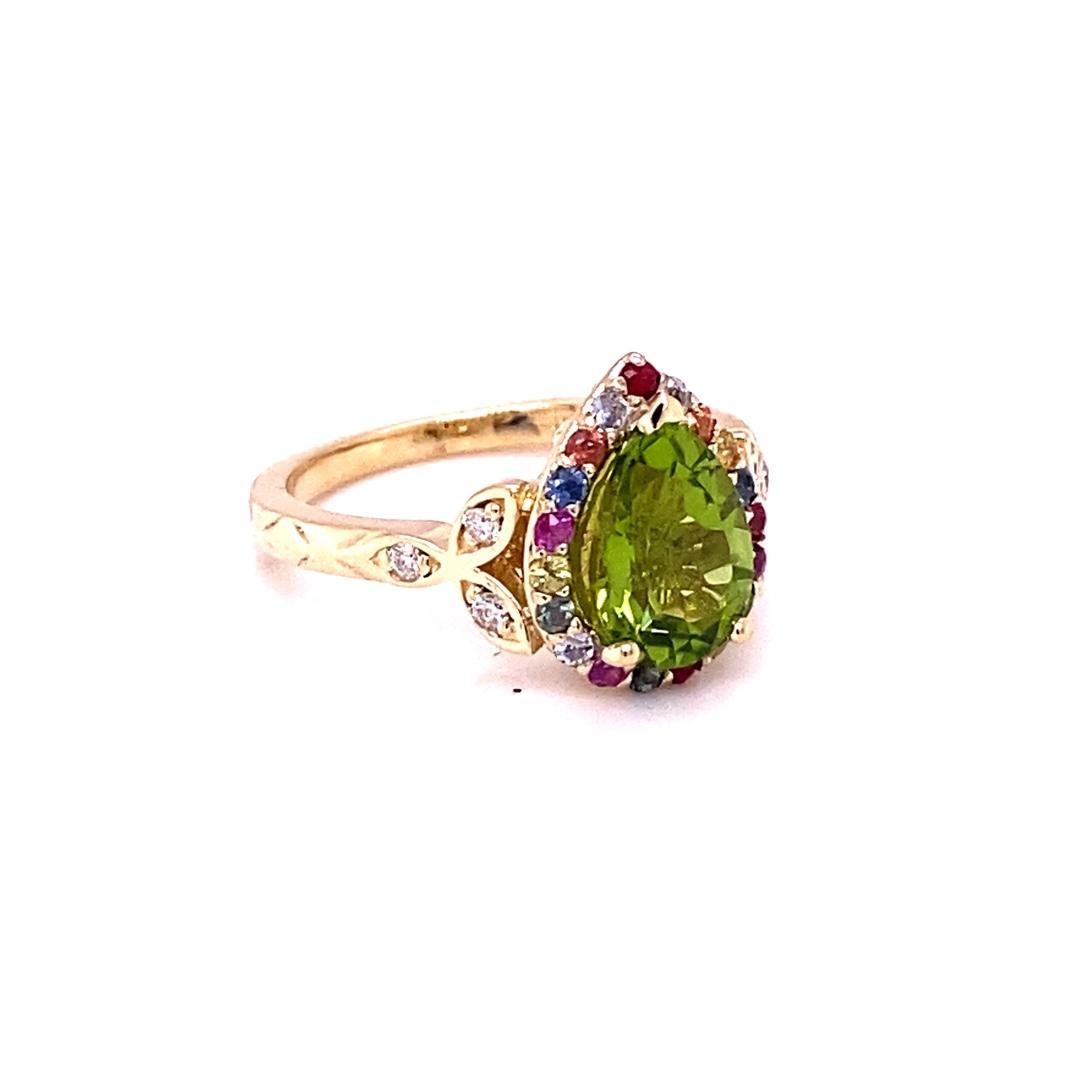2.52 Carat Natural Peridot Sapphire Yellow Gold Cocktail Ring

This beautiful ring has a Pear Cut Peridot in the center that weighs 2.03 carats. The Peridot is surrounded by 19 Multi-Colored Sapphires that weigh 0.40 carats and is accented by 6