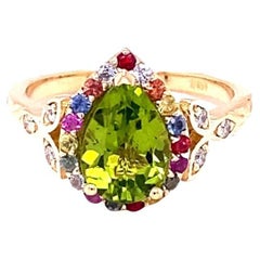 Anillo de cóctel de oro amarillo con zafiro y peridoto natural de 2,52 quilates