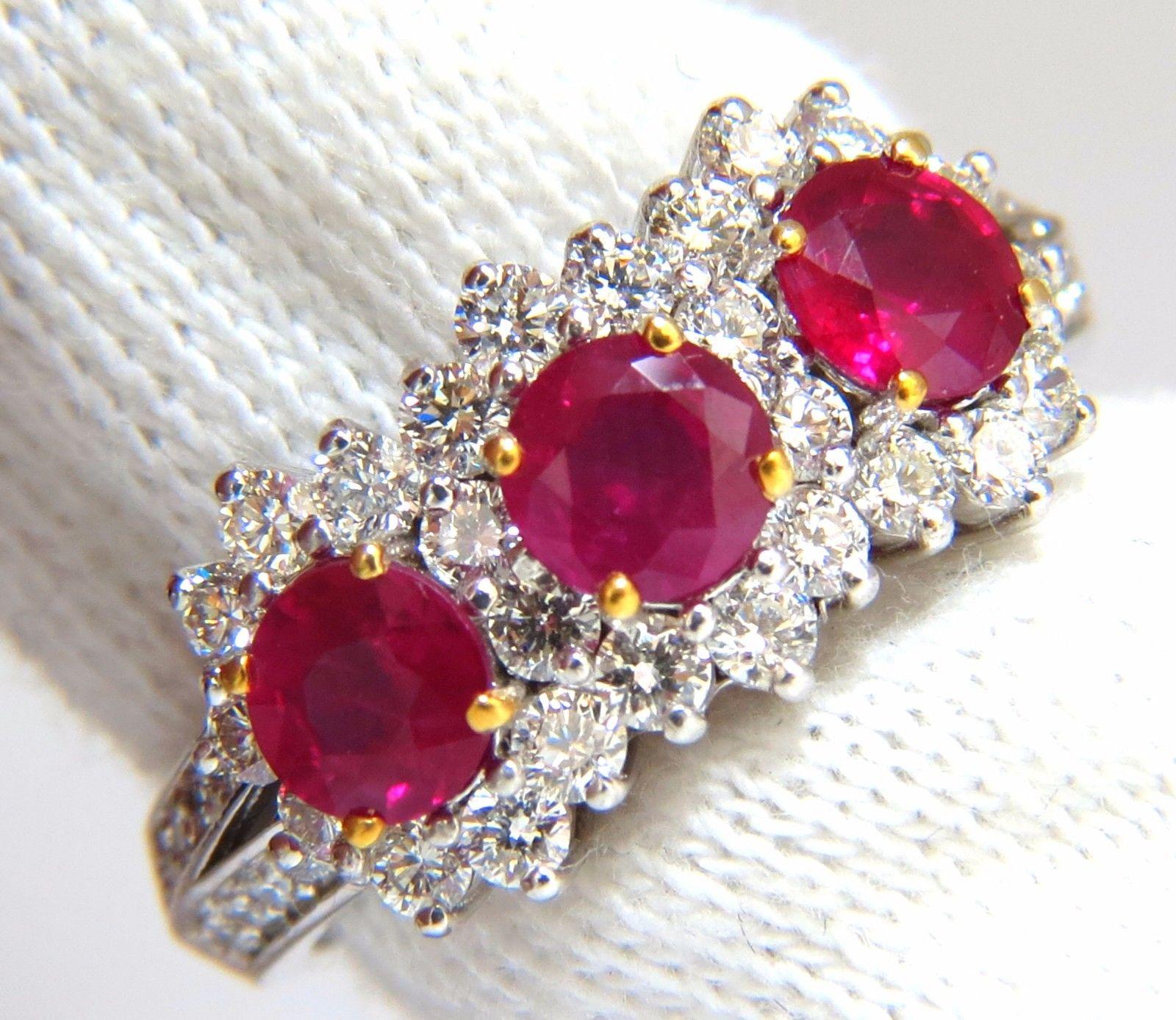 Ruby Halo Three's

1.42ct natural Rubies ring.

Vibrant vivid Reds

Transparent & clean clarity.

Round cut brilliants

4.4mm diameter 

1.00ct natural Side diamonds:

G-color Vs-2 clarity.

14kt. white gold

4.3 grams

Ring Current size: