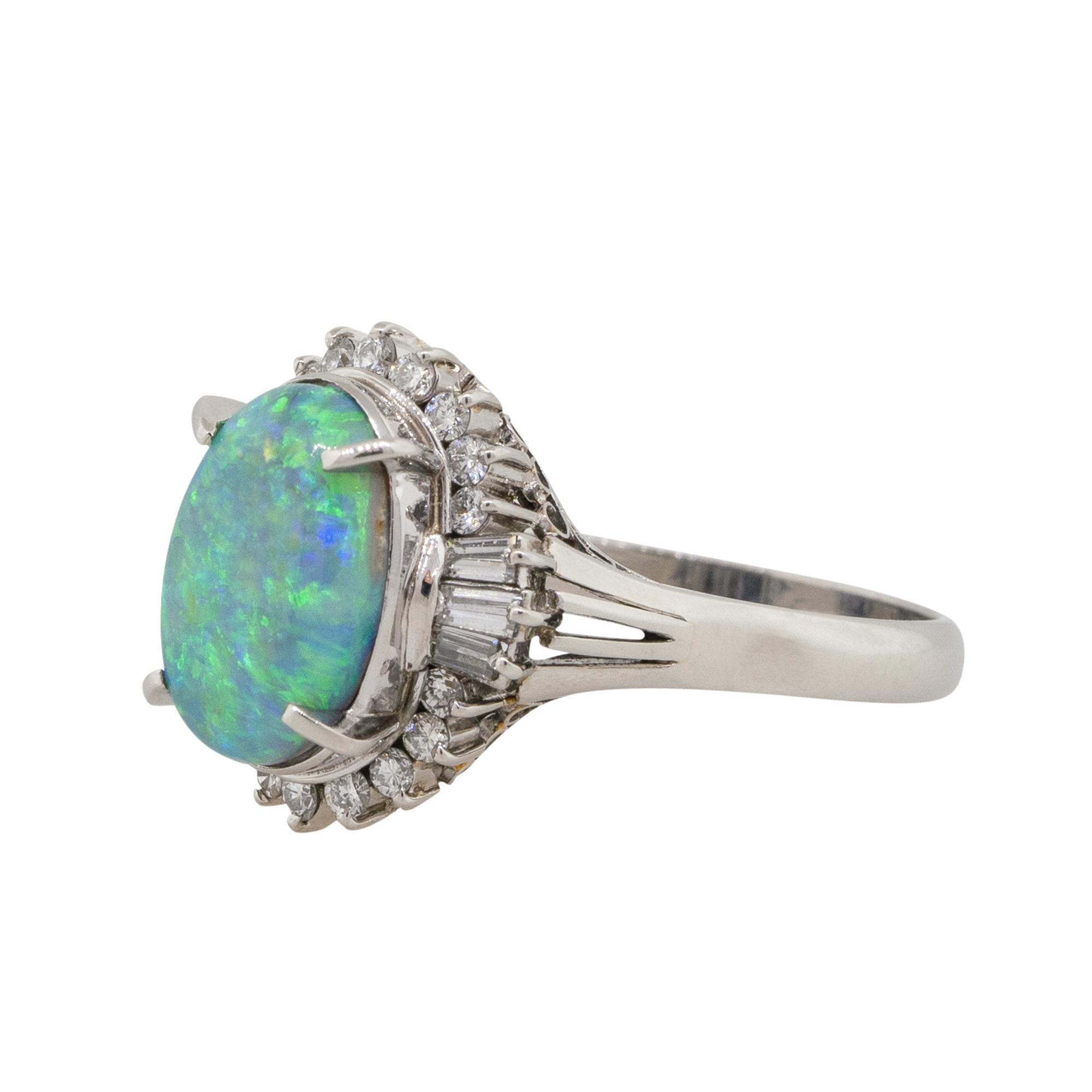 Material: Platinum
Gemstone details: Approx. 2.52ctw Oval shaped Opal center gemstone
Diamond details: Approx. 0.48ctw of Round cut Diamonds. Diamonds are G/H in color and VS in clarity
Ring Size: 8.25 
Ring Measurements: 0.75