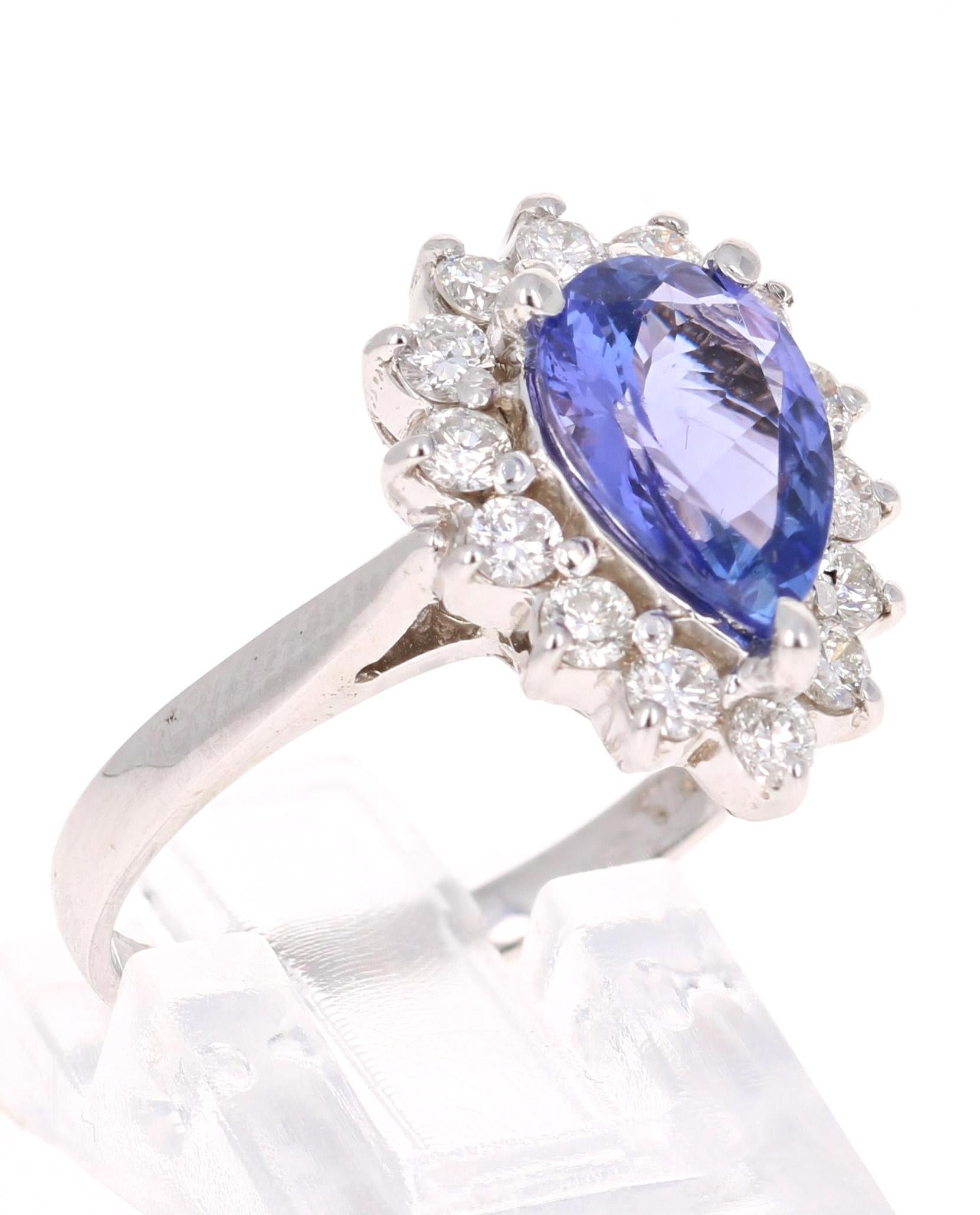 2.52 Carat Tanzanite Diamond 14 Karat White Gold Engagement Ring

This ring has a simply stunning Pear Cut Tanzanite weighing 1.88 Carats. The traditional ballerina setting has 14 Round Cut Diamonds that weigh 0.64 carats which beautifully float