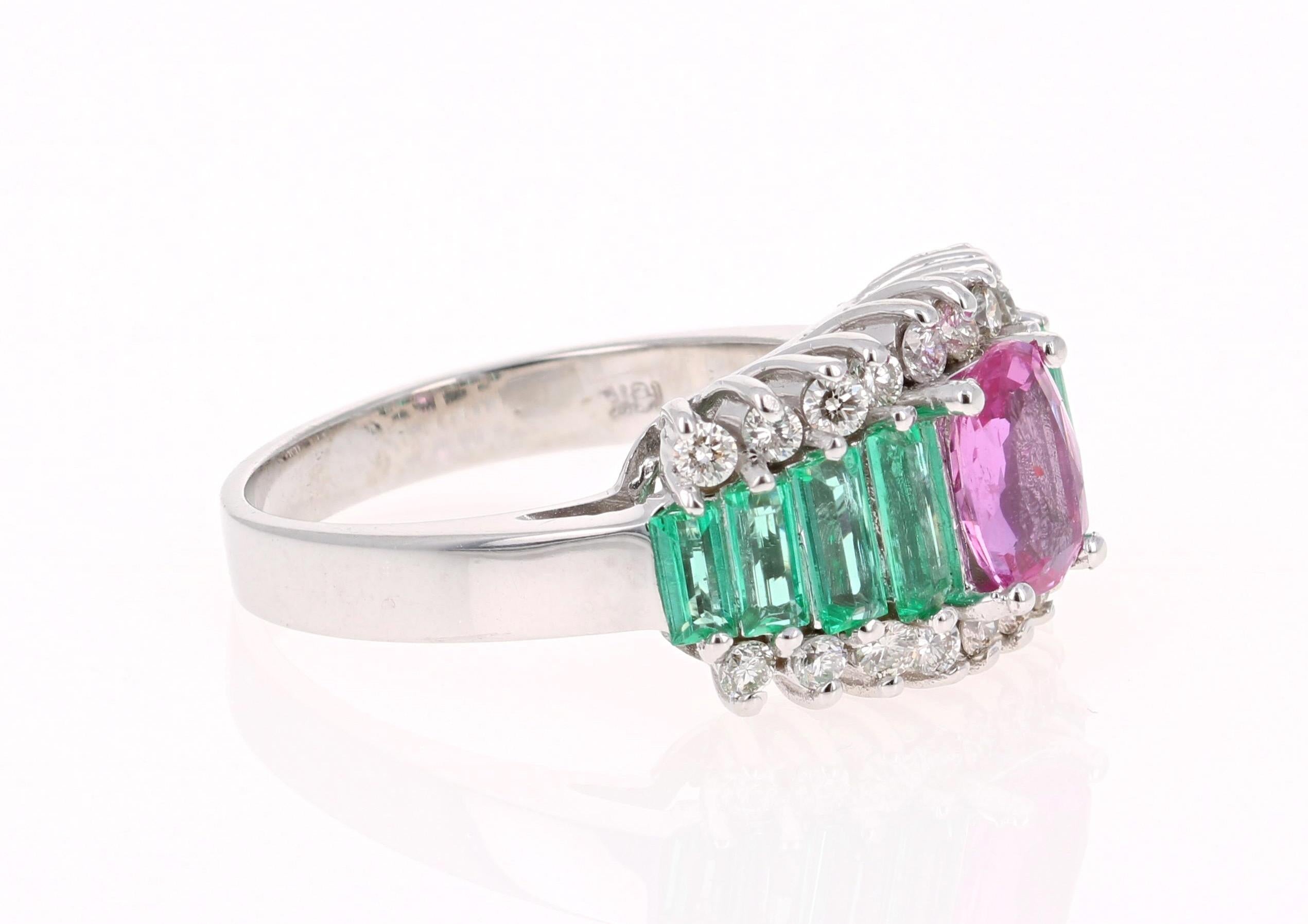 Beautiful and Unique Pink Sapphire, Emerald, & Diamond Ring!! 

This ring has an Oval Cut Pink Sapphire that weighs 1.02 Carats. The Pink Sapphire is a NO HEAT/GIA Certified stone. 
The GIA Certificate # is: 2191781541.

The ring is embellished with