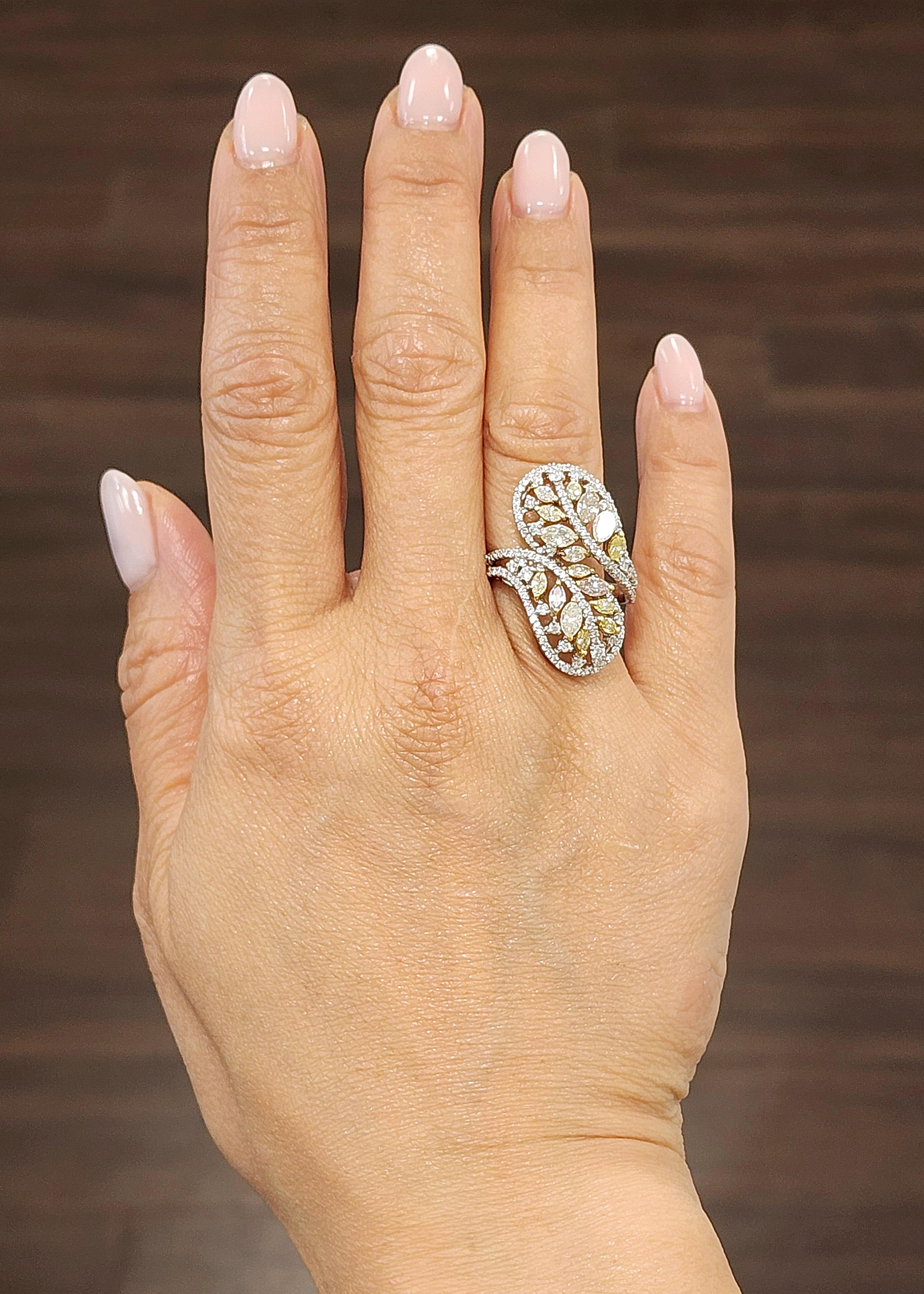Get ready to add a touch of elegance to your jewelry collection with this stunning 2.52 ct diamond ring. Featuring a beautiful marquise-shaped natural pink and natural yellow diamonds, this ring is set in 18k white gold with additional diamond