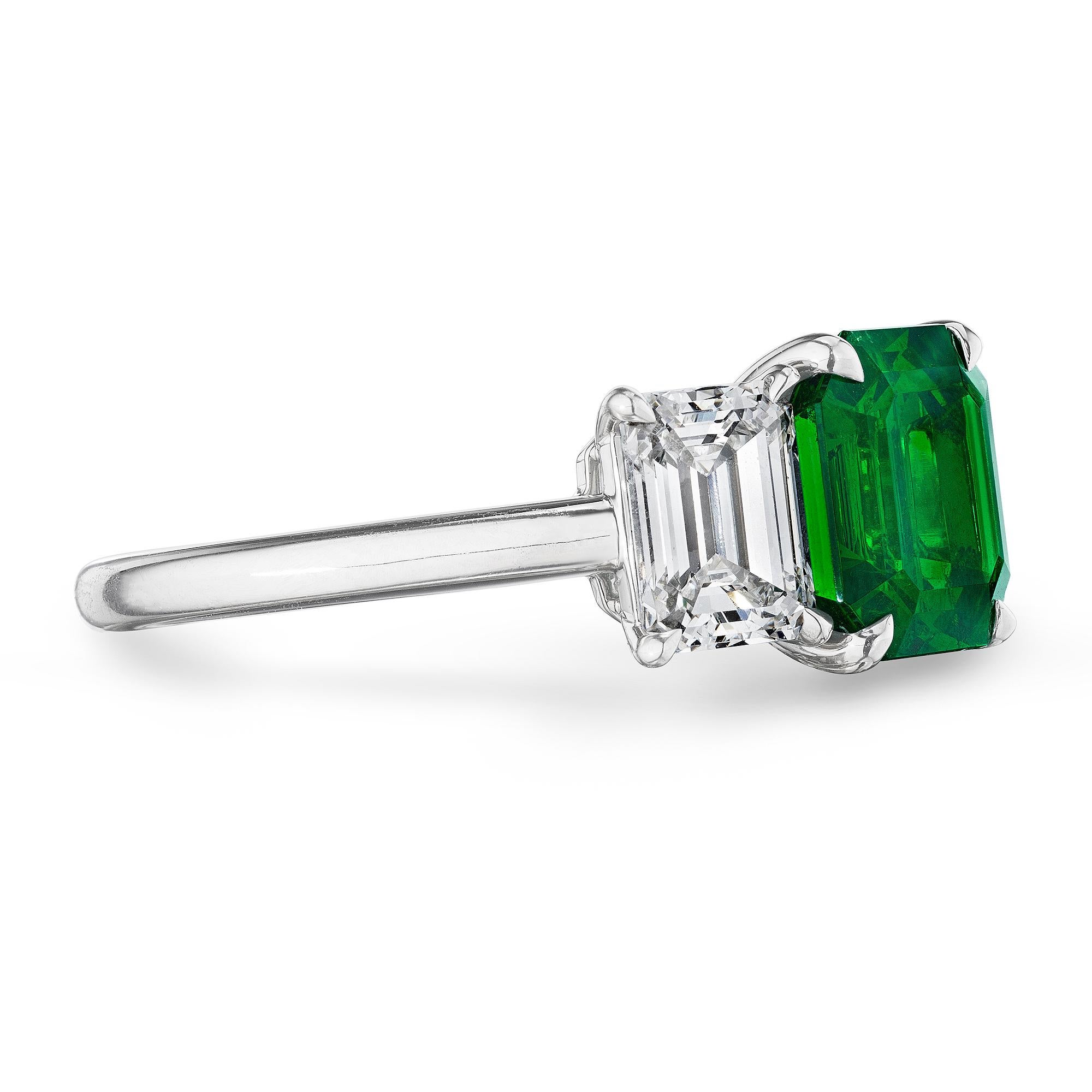 This extraordinary 2.52 carat natural no oil Colombian square cut emerald ring is simply mesmerizing.  The AGL certified square emerald cut center stone is a breathtaking luscious vivid green with two GIA certified icy white emerald cut diamond side