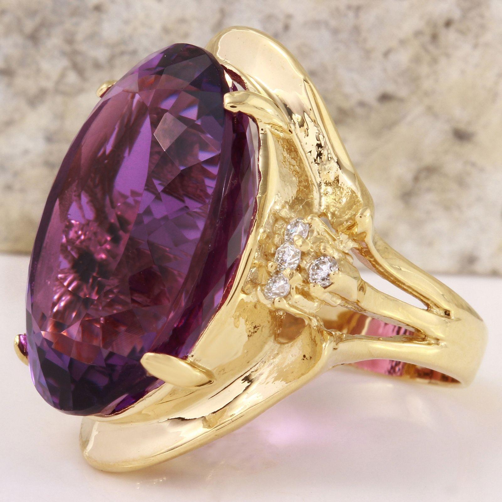 25.25 Carats Natural Amethyst and Diamond 14K Solid Yellow Gold Ring

Total Natural Oval Shaped Amethyst Weights: 25.00 Carats (VVS)

Amethyst Measures: 22.64 x 16.16mm

Natural Round Diamonds Weight: .25 Carats (color G / Clarity VS2-SI1)

Ring
