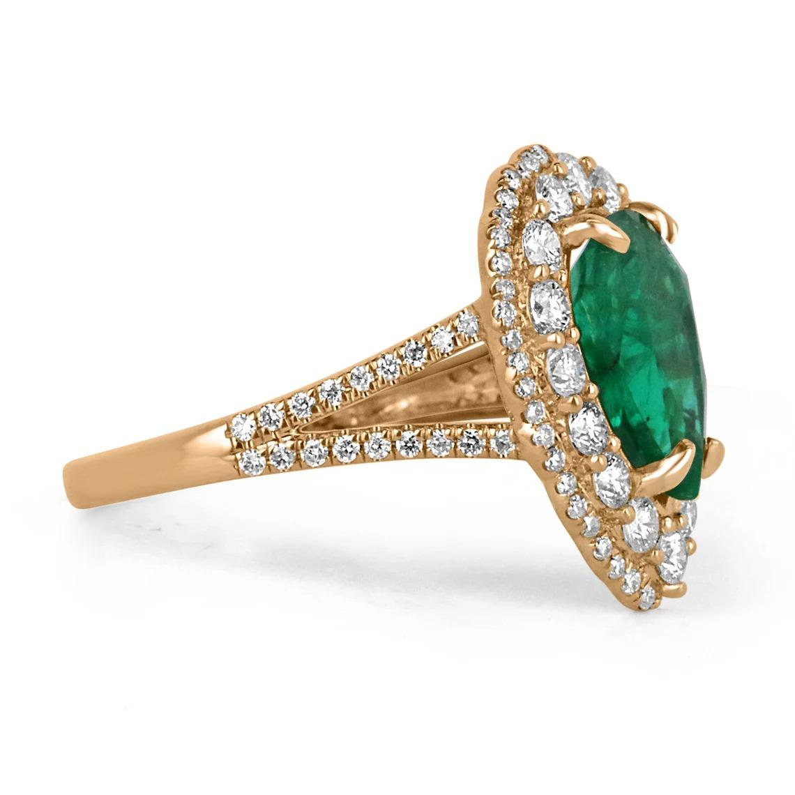 A showstopping emerald and diamond engagement/right-hand ring. This exquisite piece features a natural fine-quality emerald, cut into the shape of a pear and showcases a deep, rich dark green color with remarkable clarity and luster. Accenting