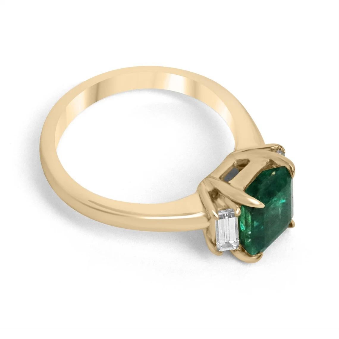 Featured is a stunning natural emerald and diamond, three-stone ring. A full 2.09 carats of pure, natural, Zambian beauty! This emerald displays a gorgeous, deep dark green color, with very good luster. Complimenting the center stone are two