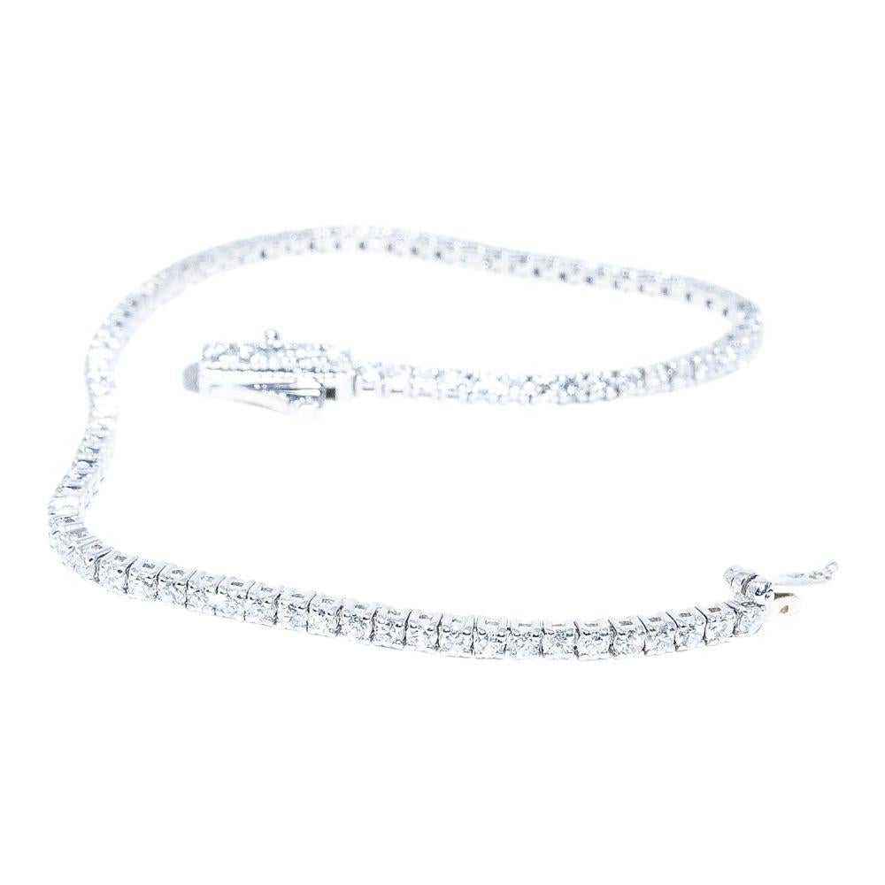 14k white gold bracelet containing 2.53 carats of prong set diamonds. The color and clarity grades of the diamonds contained within the bracelet are E-F, VS1-SI1, respectively. The average polish, symmetry, and cut grade for each of these diamonds