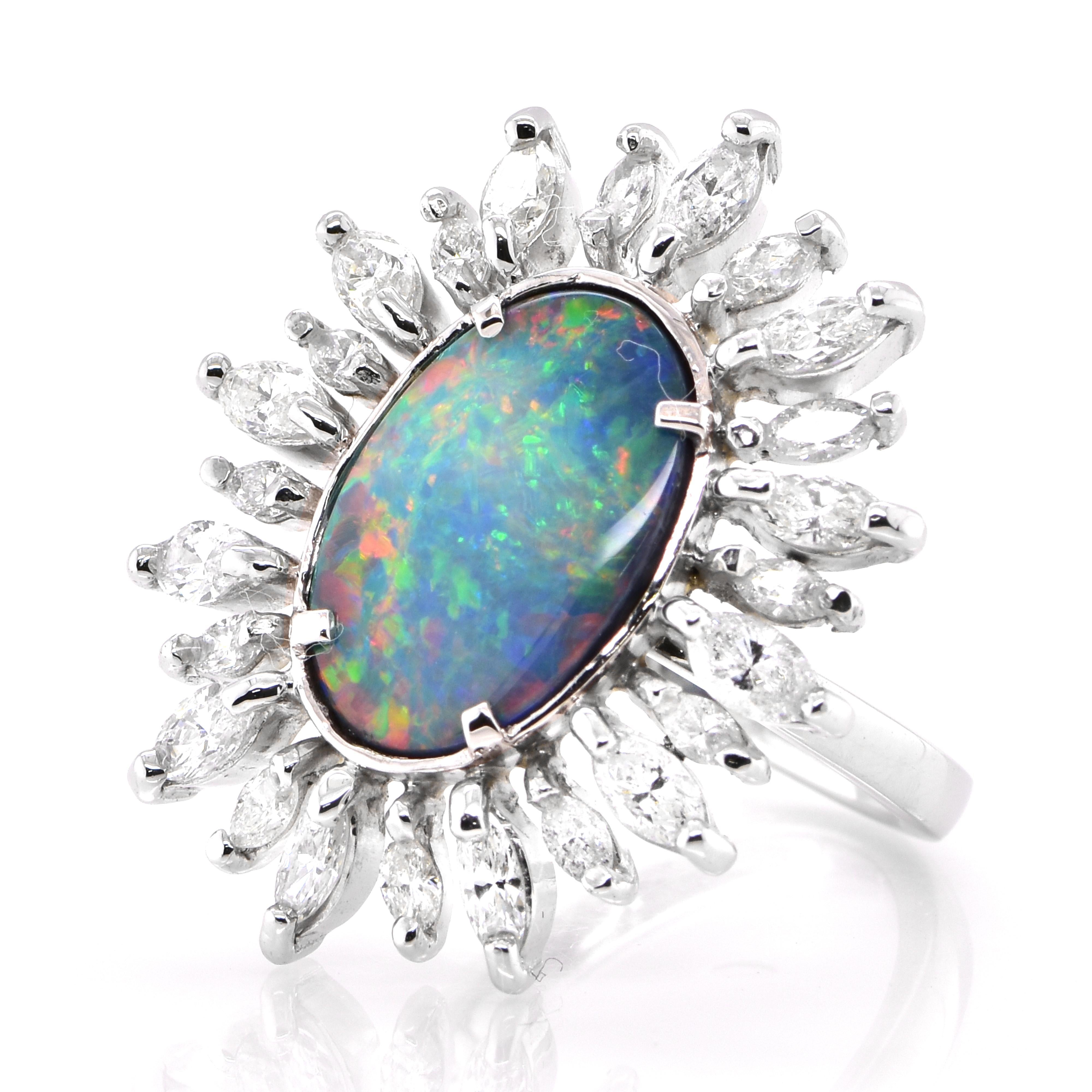 A beautiful ring featuring a 2.537 Carat, Natural, Australian (Lighting Ridge) Black Opal and 1.63 Carats of Diamond Accents set in Platinum. The Opal displays very good play of color! Opals are known for exhibiting flashes of rainbow colors known