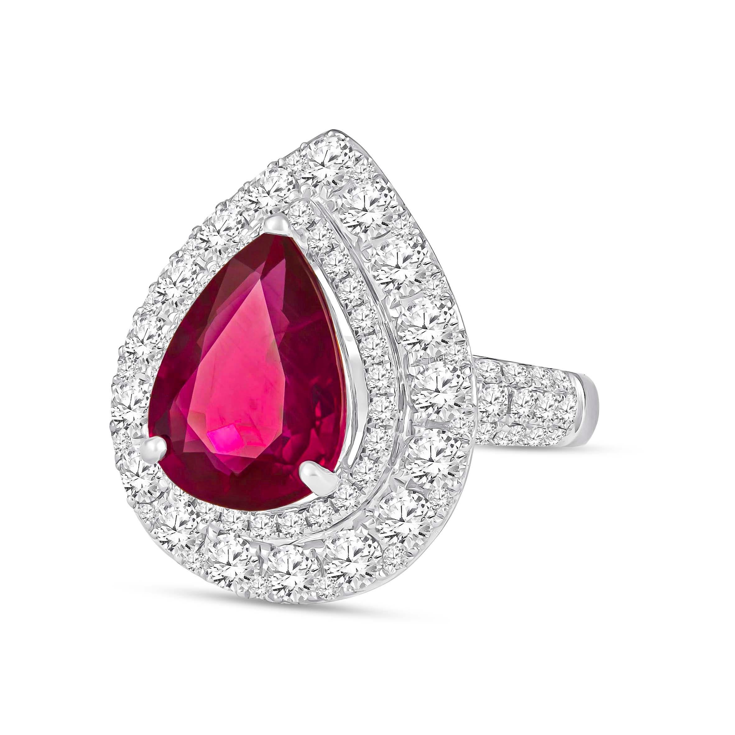Absolutely gorgeous 18K white gold ring showcasing one, GIA certified, 2.53 carat pear shaped Mozambique natural ruby. The center stone is beautifully surrounded by 1.41 carats of round brilliant cut diamonds perfectly set in double halo form and