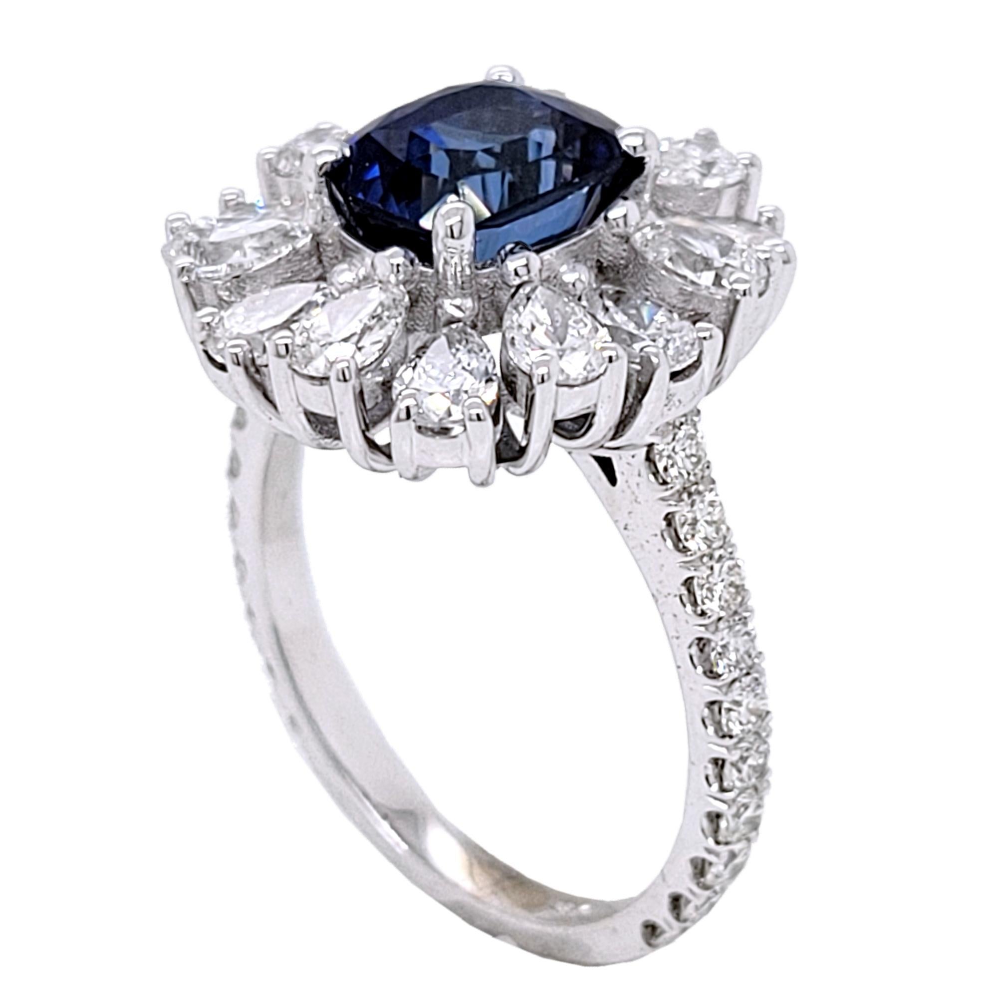 A  Beautiful Color 2.53 Ct Cushion Shaped Sapphire set in a gorgeous 18k gold  Pave set engagement Ring with halo of Pear Shape Diamonds. Total diamond weight of 1.86 Ct. diamonds on the side. 

Center stone: 2.53 Ct Cushion Shape Sapphire
Side