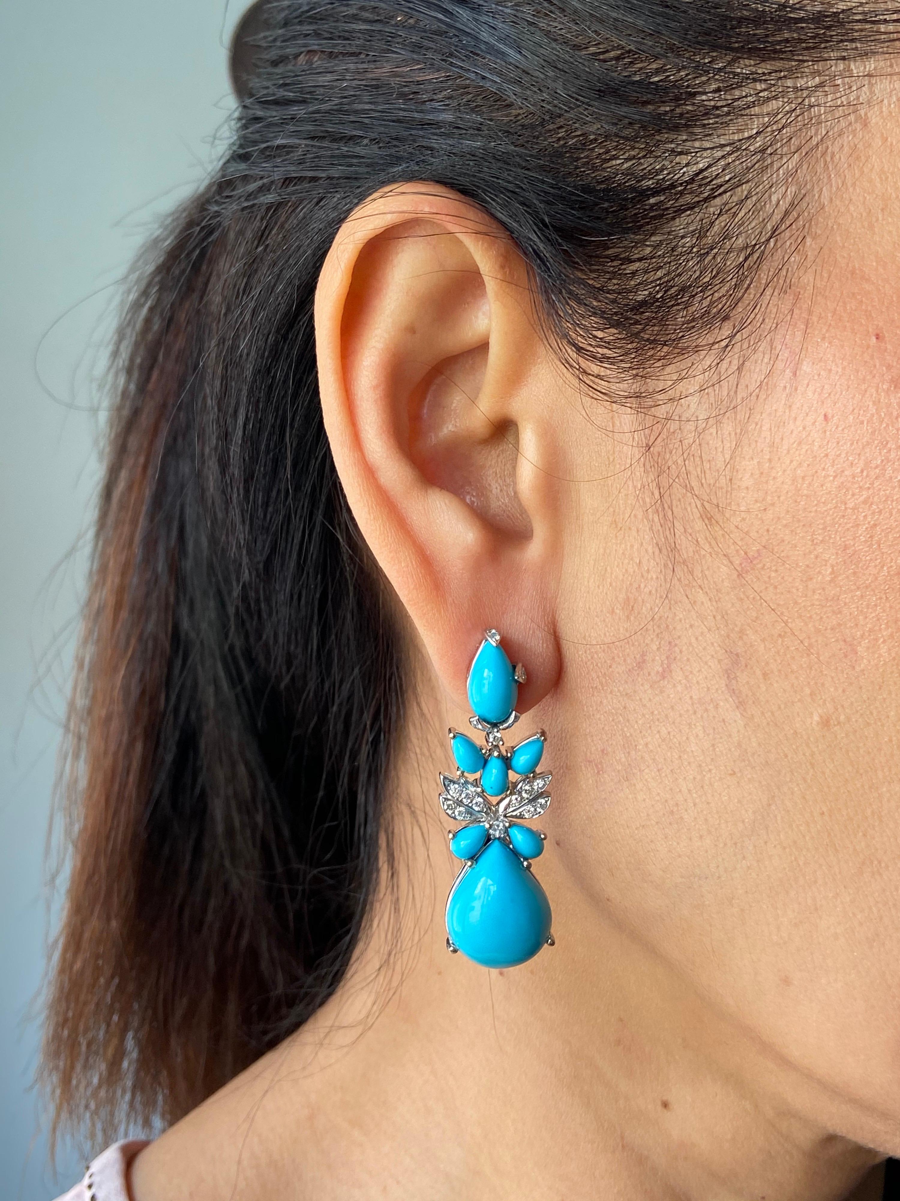 A beautiful pair of pear shape cabochon natural Turquoise and Diamond earrings, set in 18K White Gold. A push-pull backing is used for this pair.

Stone Details:
Turquoise: 24.39 carat
Diamond: 0.36 carat

18K Gold: 17.35 grams