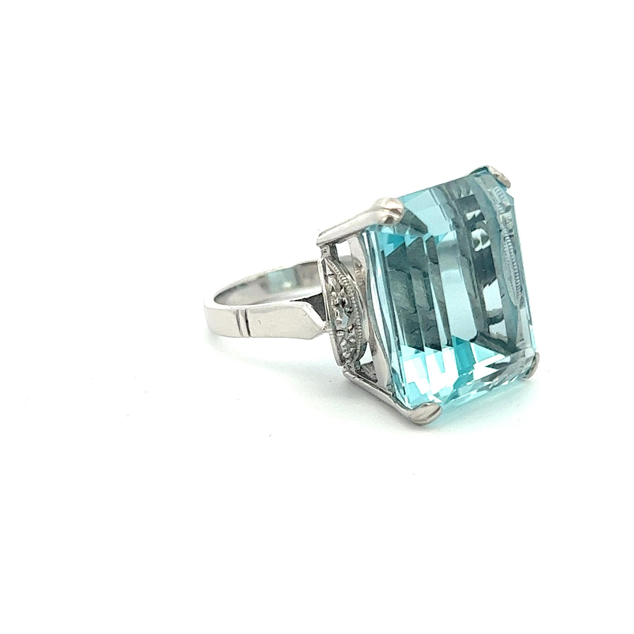 Presenting an awe-inspiring aquamarine ring showcasing a magnificent GIA certified 25.3 carat emerald cut aquamarine securely set in an elegant four-prong setting.

Circa 1960 - 1970s, purchased from an estate, the centre stone is beautifully