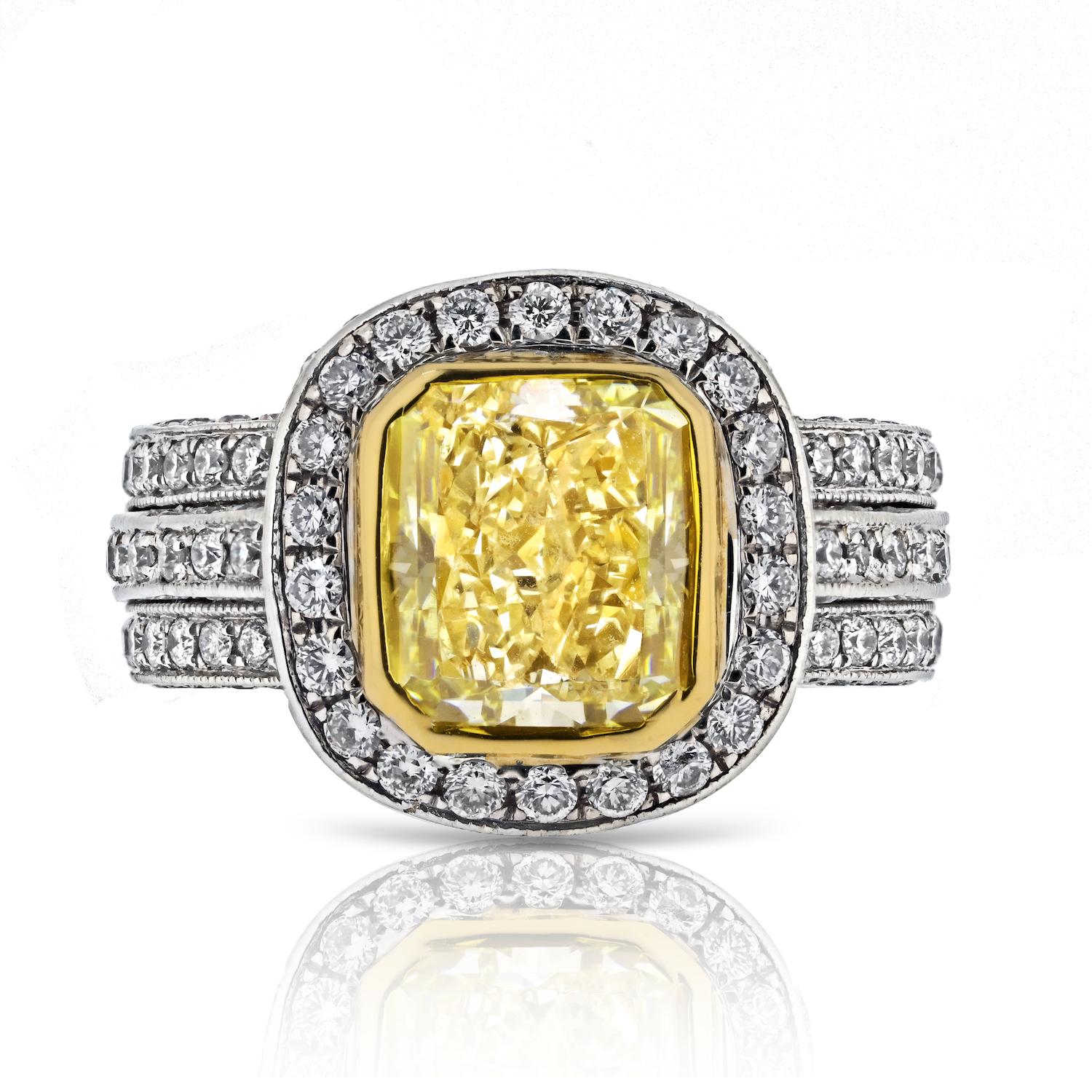 Elevate your love story with this exquisite 2.53-carat Light Fancy Yellow Diamond Engagement Ring, a radiant testament to superior craftsmanship and timeless elegance. 

The centerpiece, a GIA-certified 2.53ct Fancy Light Yellow radiant cut diamond