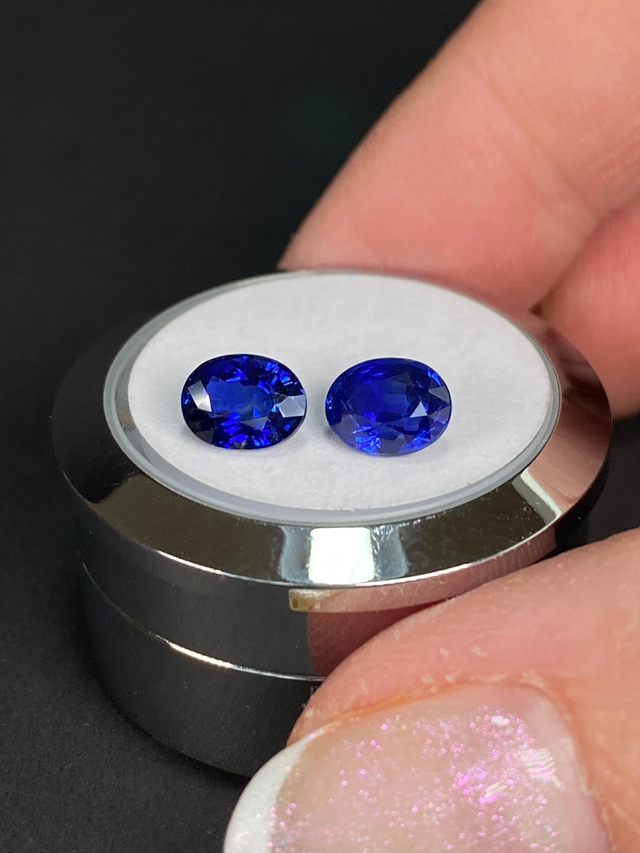 The Sapphire Merchant presents this Vivid Royal Blue Sapphire Pair, a true embodiment of luxury and elegance. This exceptional duo combines a total weight of 2.53 carats, with one gemstone weighing 1.23 carats and the other 1.30 carats. Both gems