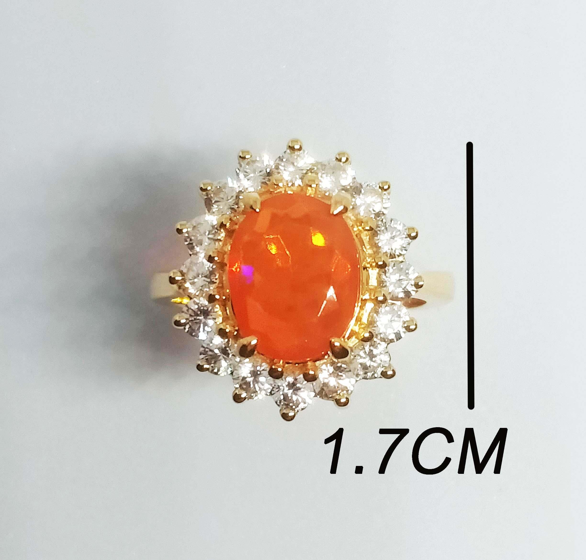 Orange Opal Oval 10x7.7 mm. (2.53cts)
White Zircon Round. 2.5 mm 16 pcs.
Sterling Silver in 18K Gold Plated.
Size ring 7 us.

