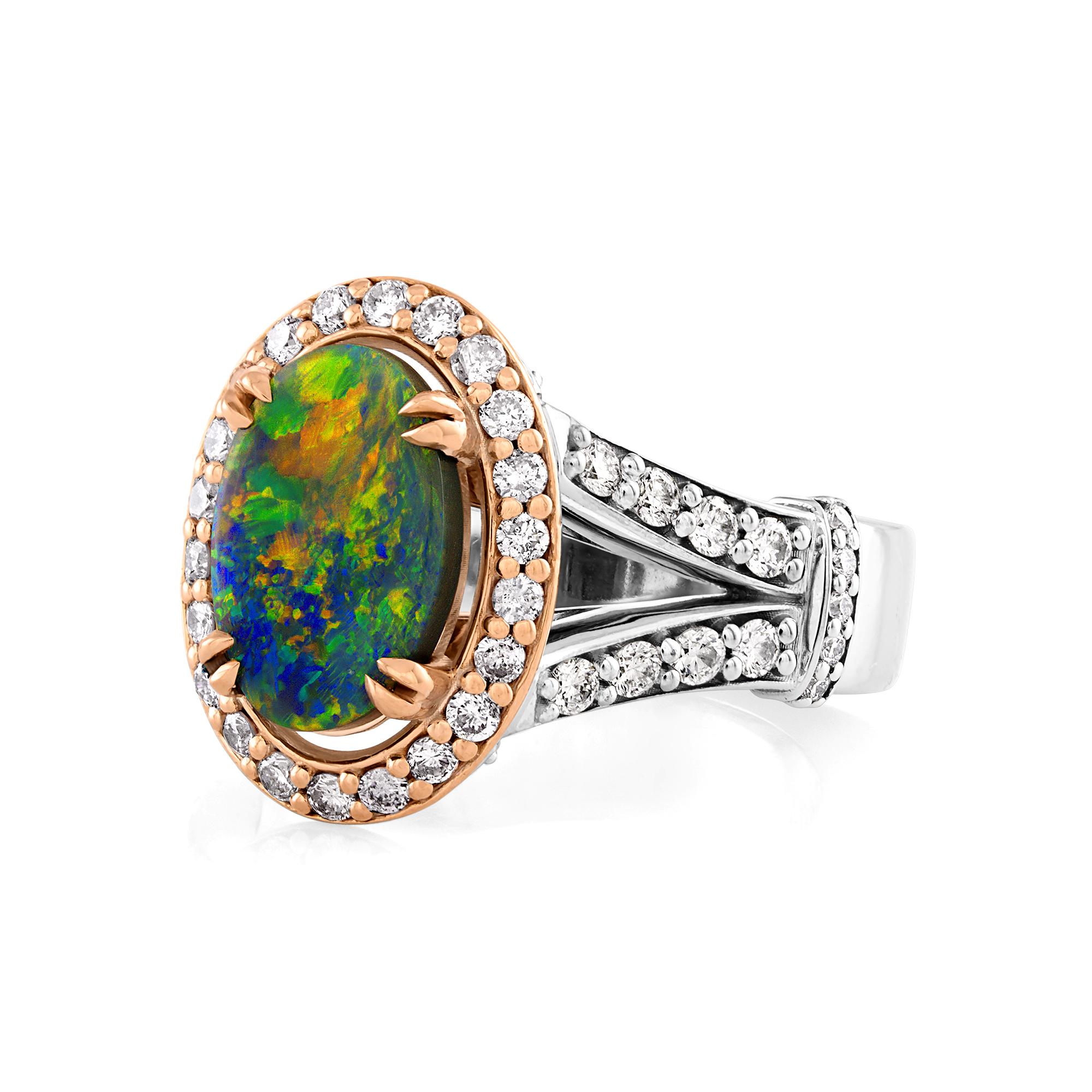 STUNNING RICH MULTI COLOR, FIREY Australian Black Opal Ring from the Lighting Ridge Mine, Pink & White Diamonds and Ruby 14k Gold Ring.

Highly collectible the Center Opal is 1.33ct, measures 11 x 7 x 2mm. Body Tone 2N, Brilliance 4 on the scale 1