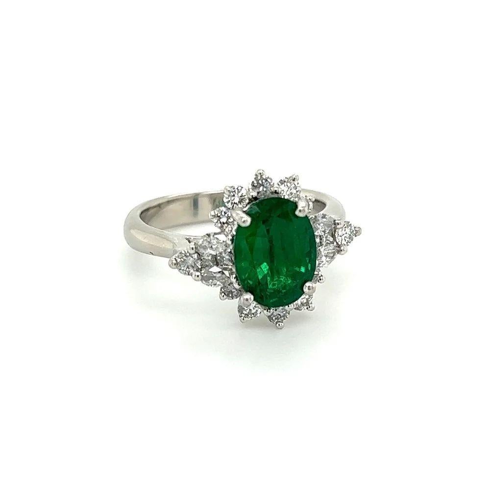 Simply Beautiful! Finely detailed Natural Green Emerald GIA and Diamond Platinum Vintage Cocktail Ring. Centering a securely nestled Hand set Fabulous GIA Oval Green Emerald, weighing 2.54 Carats. GIA #6177998777. Surrounded by Diamonds, approx.