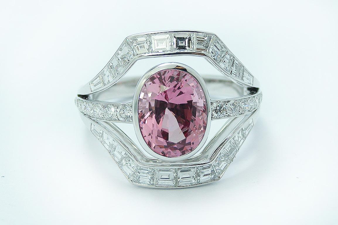 This Vivid Pink Spinel bazel set shines brilliantly in the centre of this Art Deco style ring.​
The Eye-catching stone is surrounded by refined shanks with round and square blazing diamonds. ​

Ring details:​

Spinel : 2.54 carat ​
Diamonds : 1.46