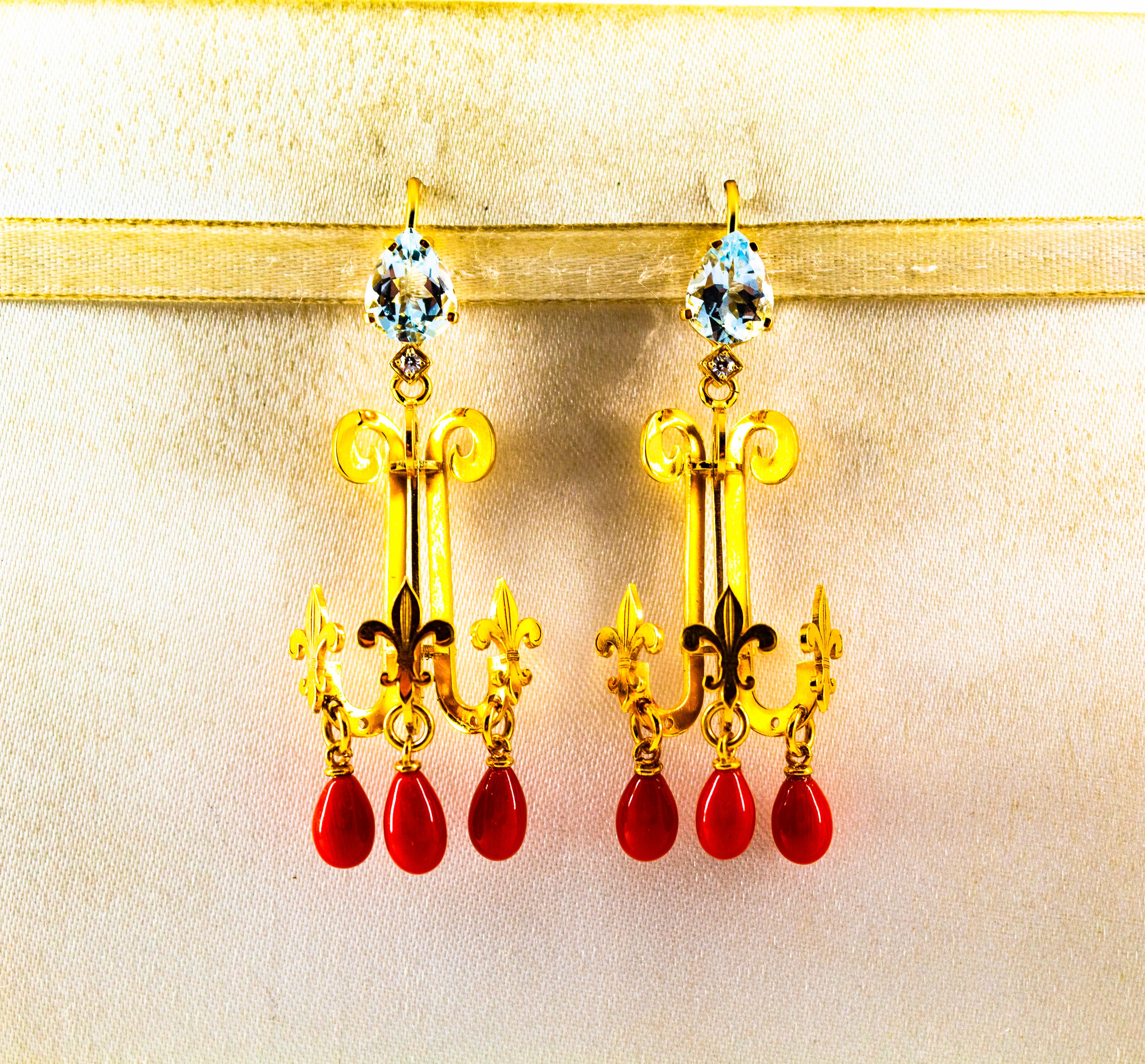 These Stud Earrings are made of 14K Yellow Gold.
These Earrings have 0.04 Carats of White Modern Round Cut Diamonds.
These Earrings have also 2.50 Carats of Aquamarines.
These Earrings have also Mediterranean (Sardinia, Italy) Red Coral.
All our
