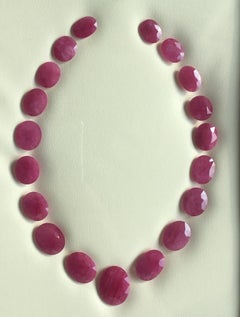 254.39 Carats Ruby Mozambique Oval Faceted Cut stone Layout Heated Natural Gem