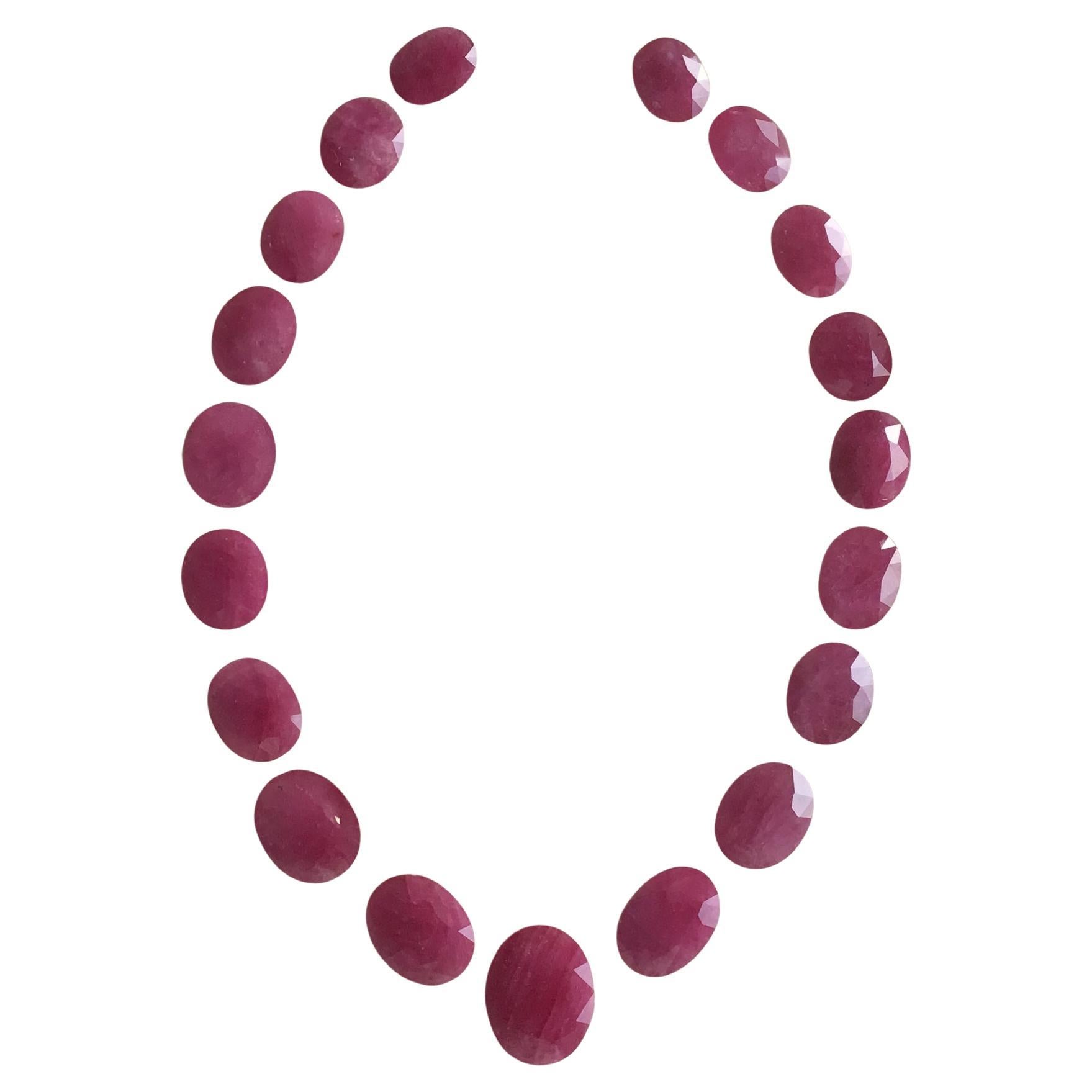 254.39 Carats Ruby Mozambique Oval Faceted Cut stone Layout Heated Natural Gem