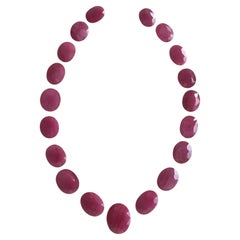 254.39 Carats Ruby Mozambique Oval Faceted Cut stone Layout Heated Natural Gem