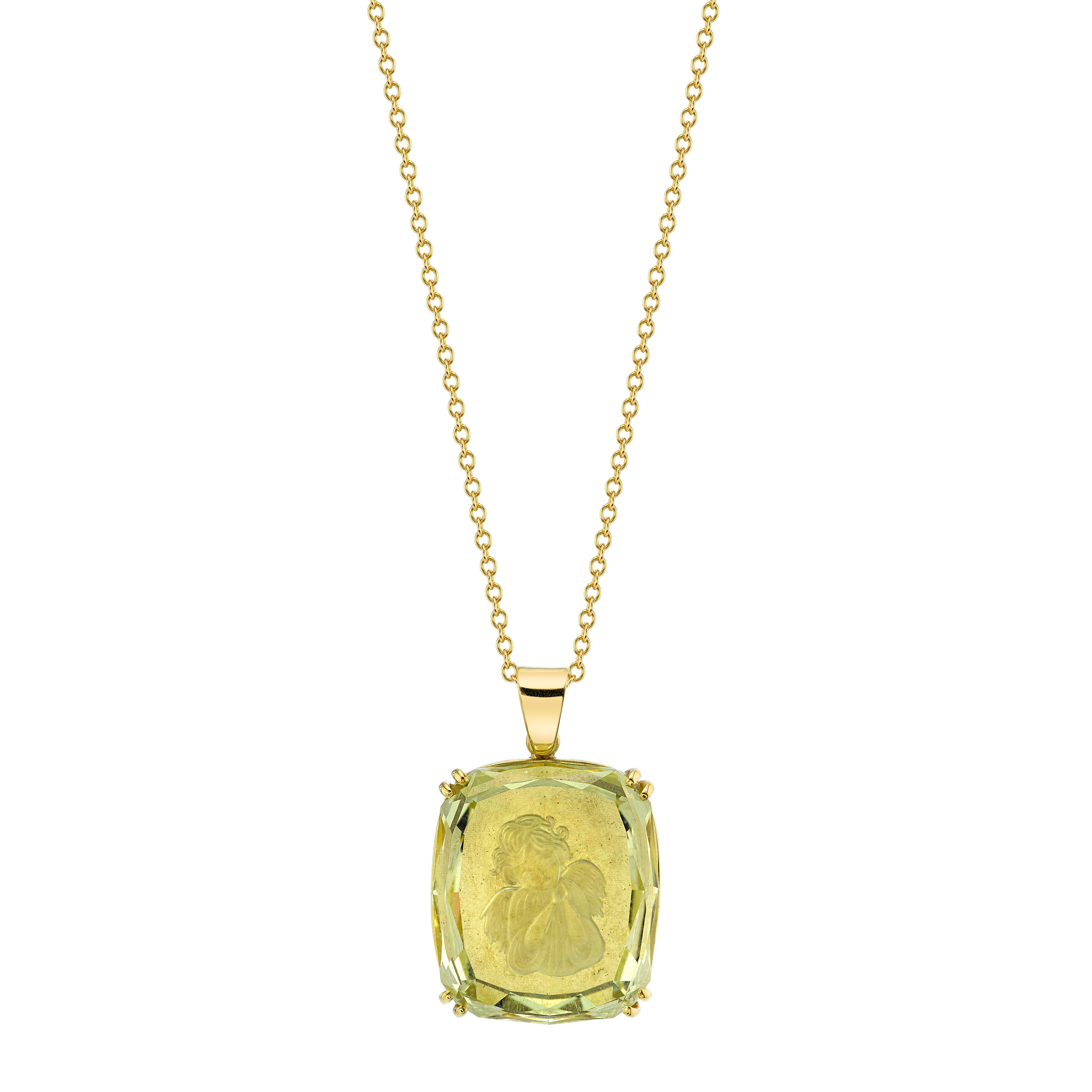 Angels are among us in this beautiful 18k yellow gold pendant featuring an exquisite, 25.49 carat golden beryl that has been carved with an angel in a reverse intaglio. This gem was carved in Russia and measures almost an inch in length. The