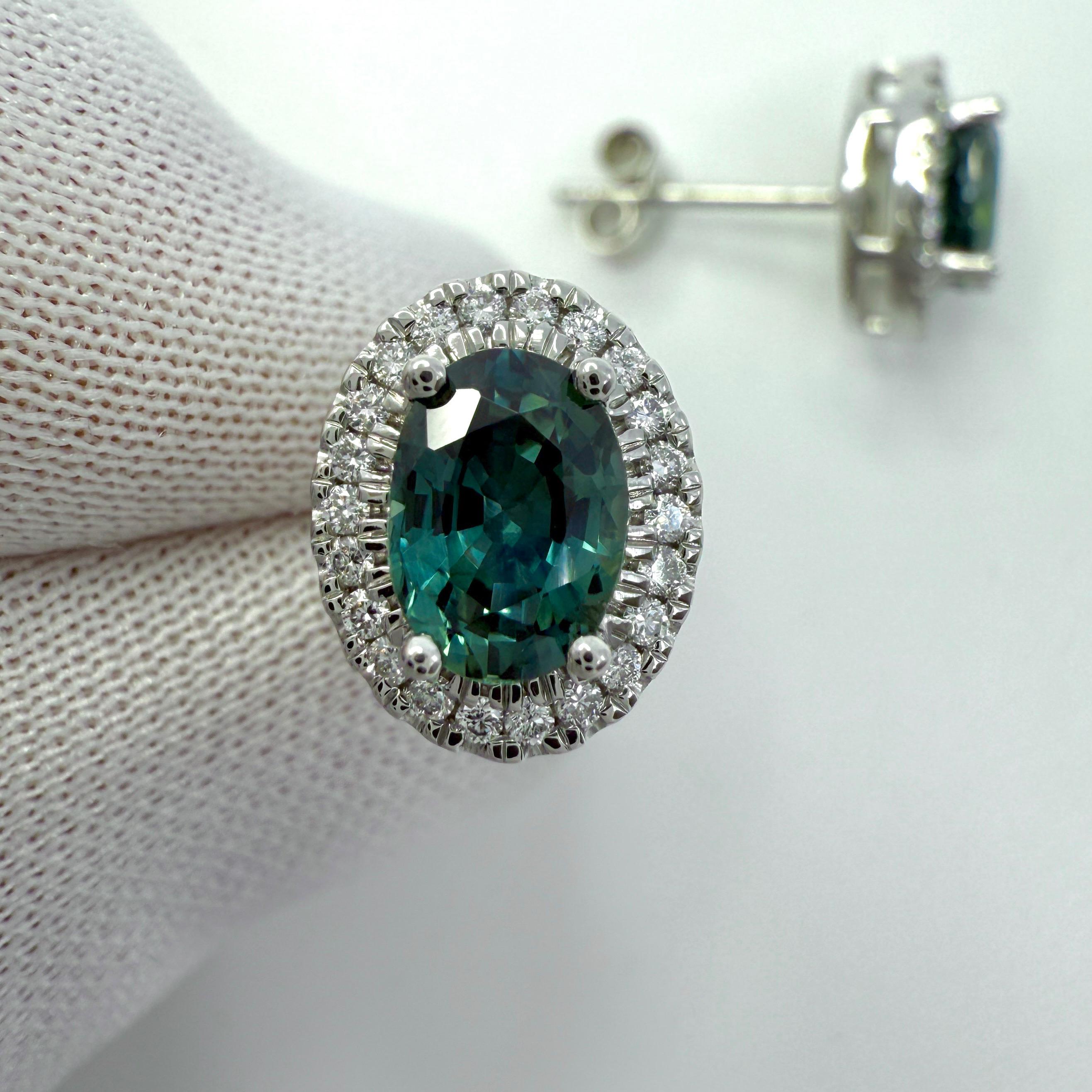 Natural Oval Cut Green Blue Teal Sapphire & Diamond Platinum Halo Earring Studs.
2.54 Total carat weight.

Two top quality matching oval cut natural sapphires. These both have a stunning deep green blue teal colour with excellent clarity and cut.