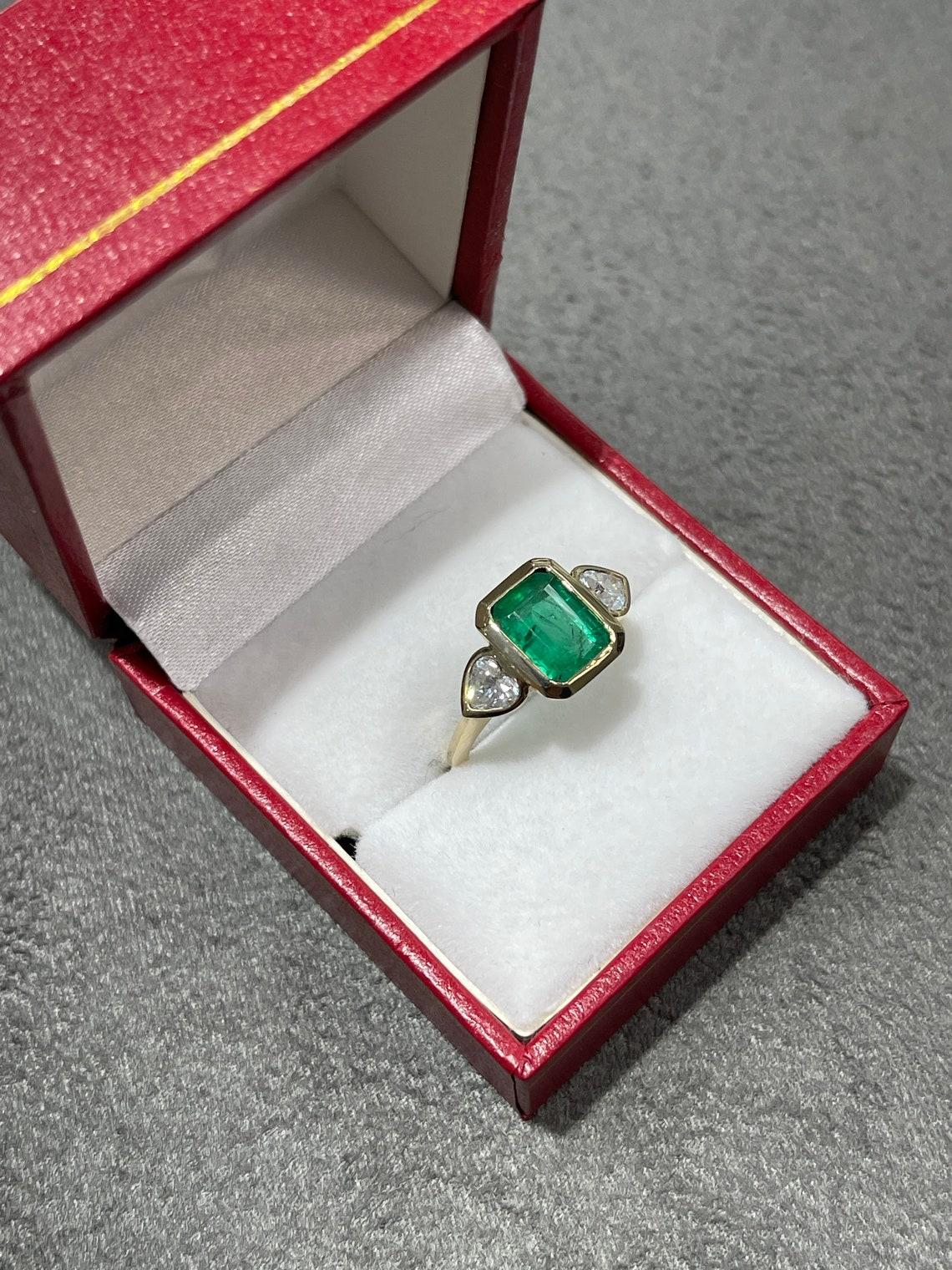 Classic 2.54tcw Bezel Three Stone Emerald-Emerald Cut & Heart Diamond 14K Ring In New Condition For Sale In Jupiter, FL