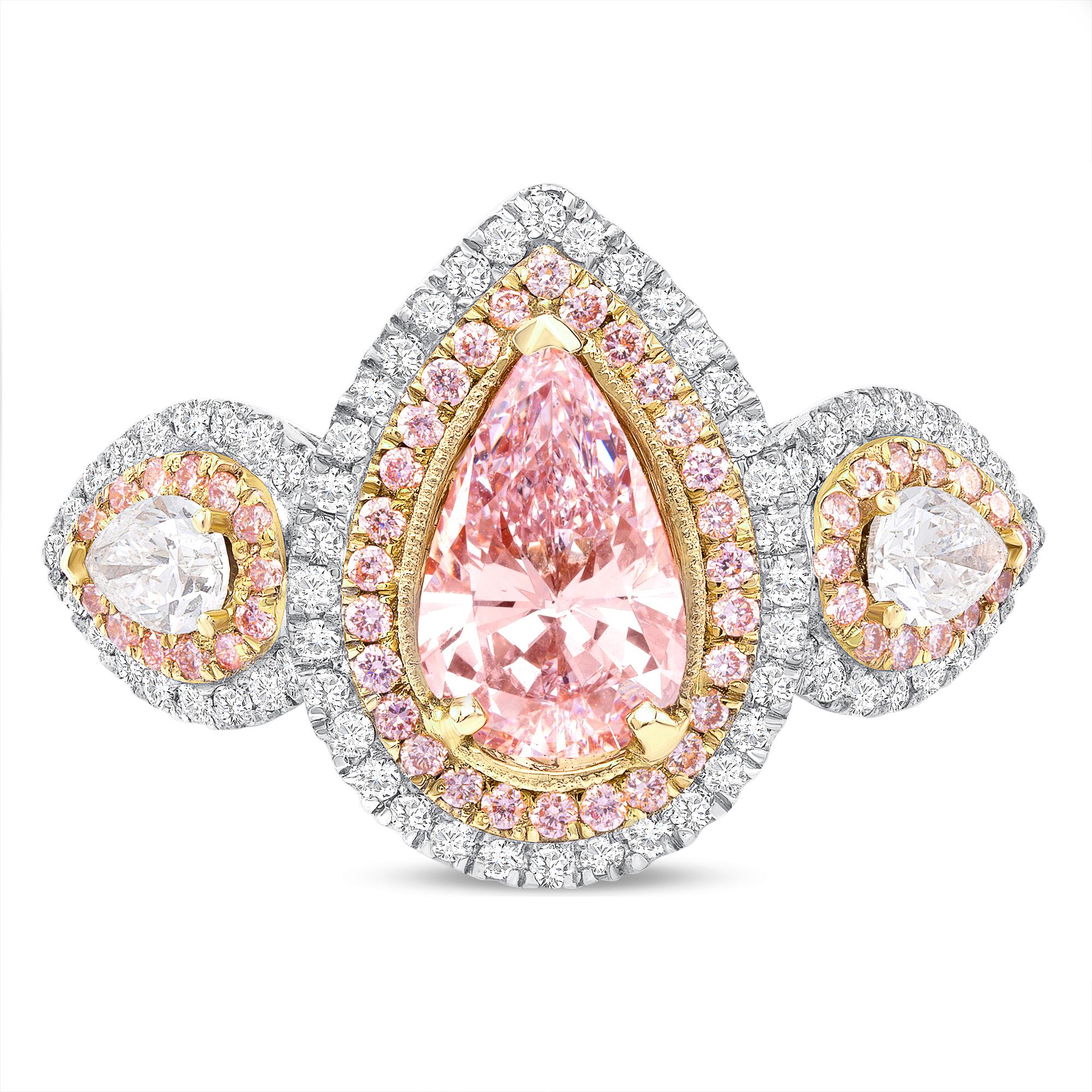 This three stone engagement ring is as rare as they come with an exotic 1.35 cts of light pink center stone and two colorless pears shapes as side stones surrounded by thousands of white and pink round diamond pave on the setting. 

GIA CERTIFIED