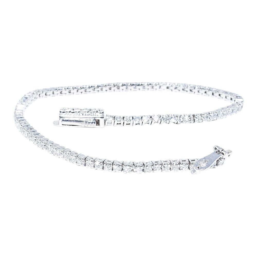 14k white gold bracelet containing 2.55 carats of prong set diamonds. The color and clarity grades of the diamonds contained within the bracelet are E-F, VS1-SI1, respectively. The average polish, symmetry, and cut grade for each of these diamonds