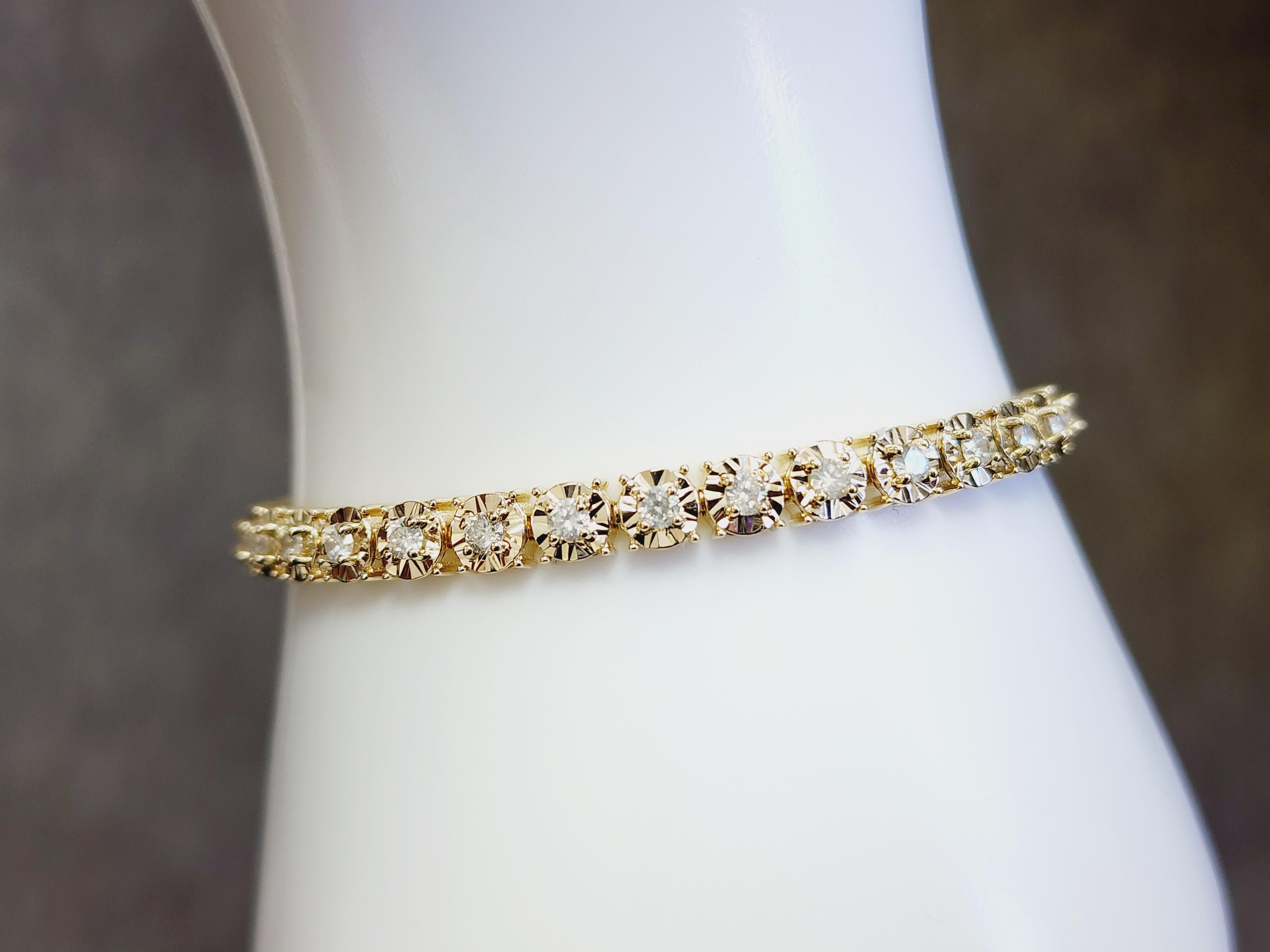 Natural Diamonds Approx. 2.55 carat total weight
Average Display Color: I, Clarity: SI
Metal Type: 4 Prong 14 karat yellow gold miracle Illusion setting
Length 7 inch