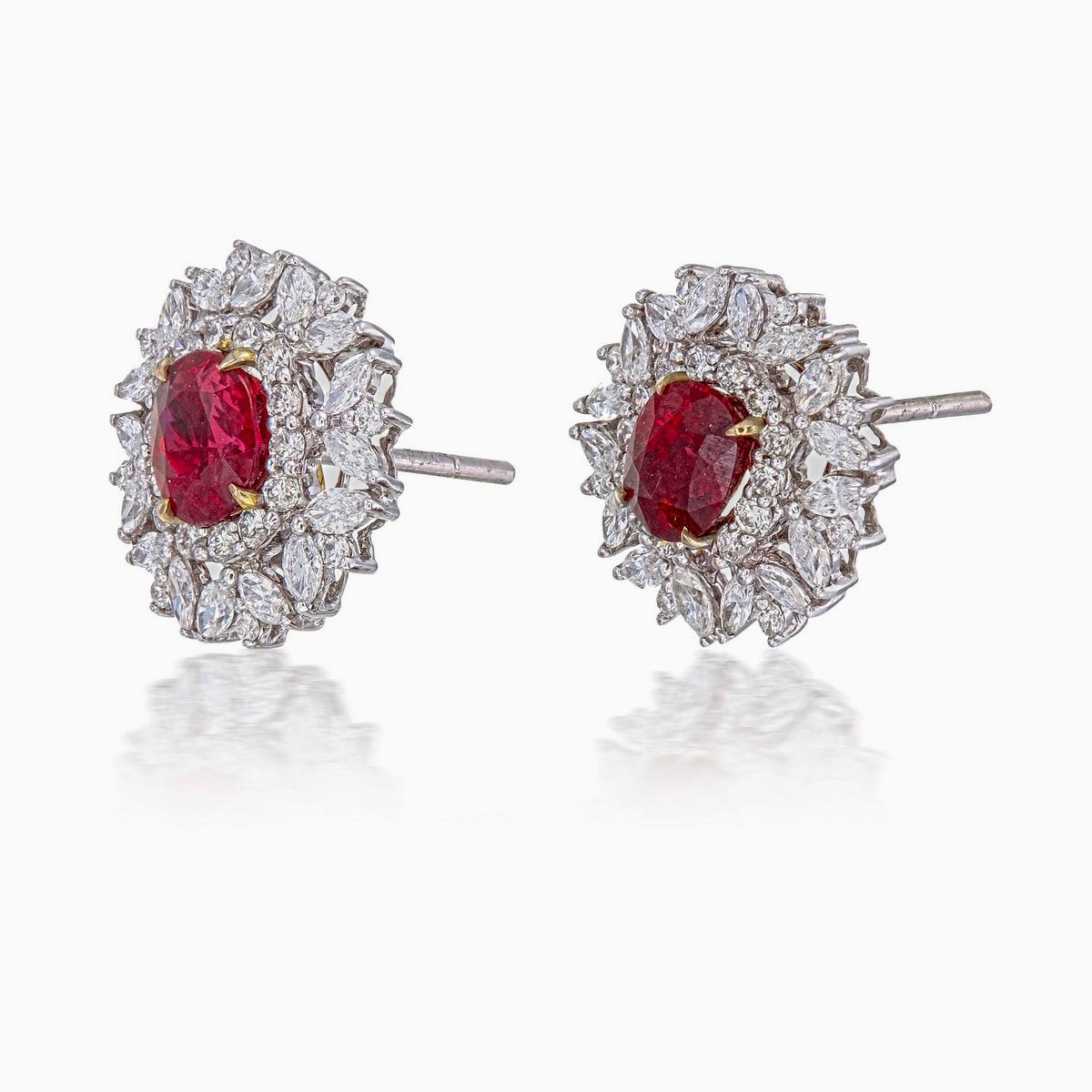 A brand new handcrafted ruby earring by Rewa Jewels. The earring’s center stones weigh 1.23ct and 1.32ct, are of Burmese origin and certified by Gem Research Swisslab (GRS) as natural, unheated, 'Pigeon blood' with certificate numbers 2021-094559