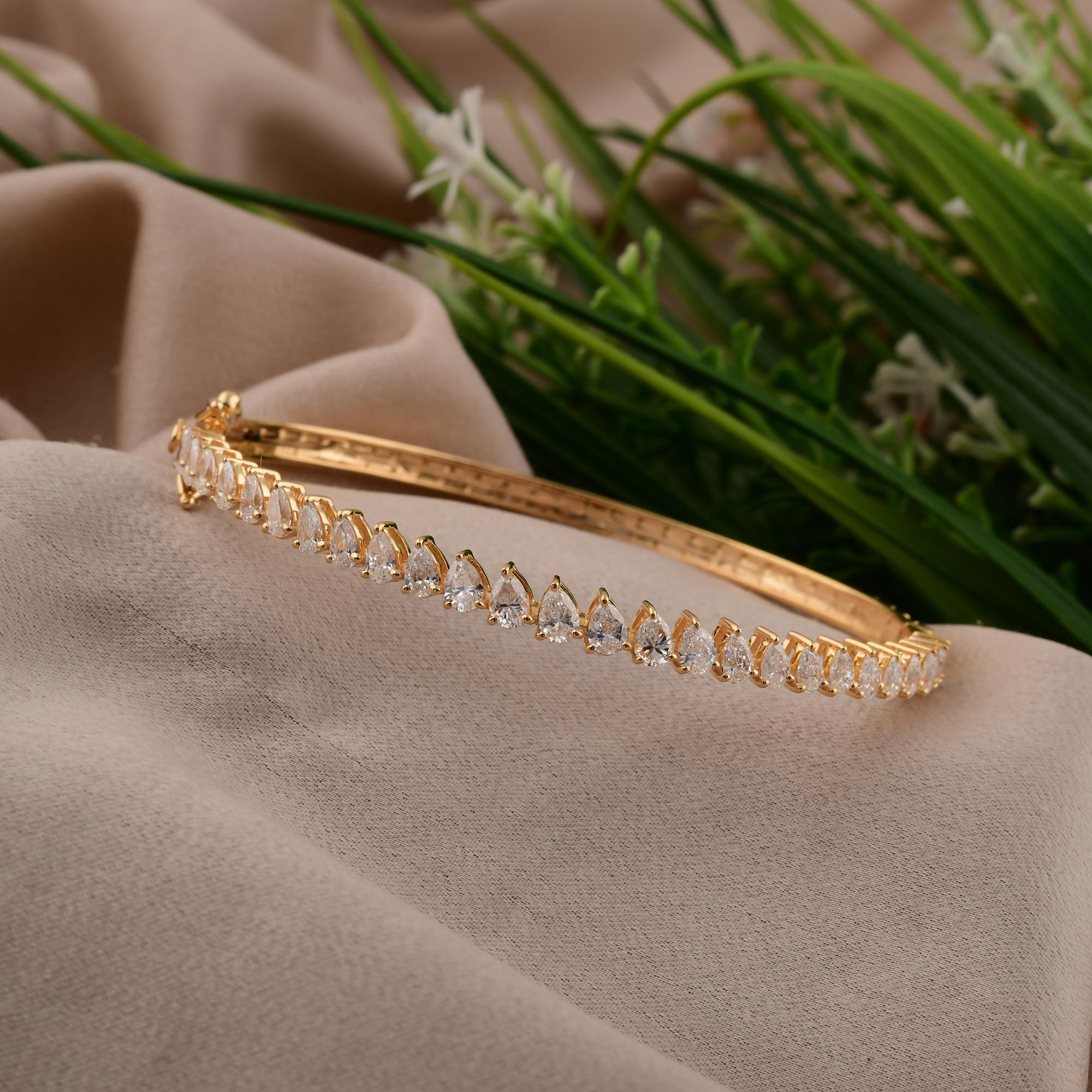 The allure of fine jewelry with our stunning 2.55 Ct Real SI/H Pear Diamond Bangle crafted from luxurious 18K yellow gold. This exquisite piece features a delicate arrangement of SI/H clarity diamonds, offering a radiant sparkle that beautifully
