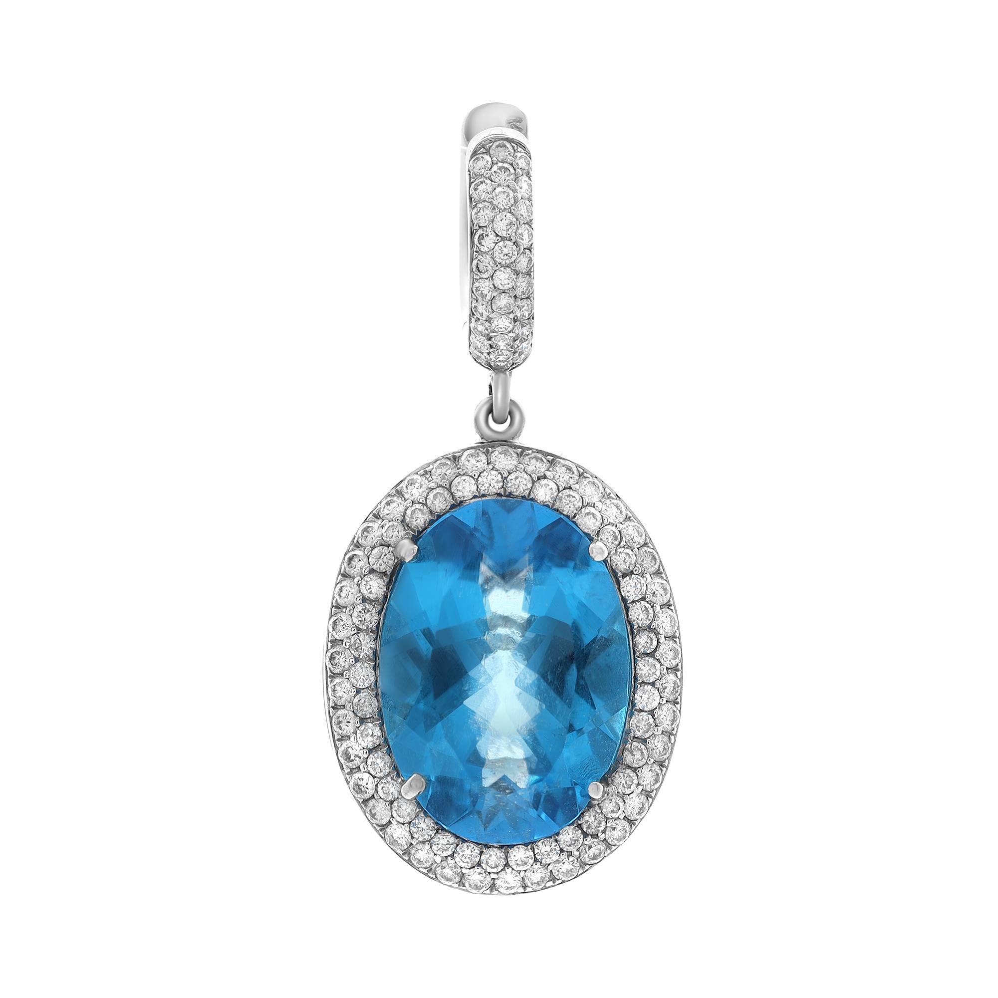 These stunning ladies drop earrings feature prong set oval shaped blue topaz weighing 25.50 carats with tiny pave set round brilliant cut diamonds weighing 2.40 carats. Diamonds are F-G color and SI1-SI2 clarity. Crafted in fine 14k white gold.