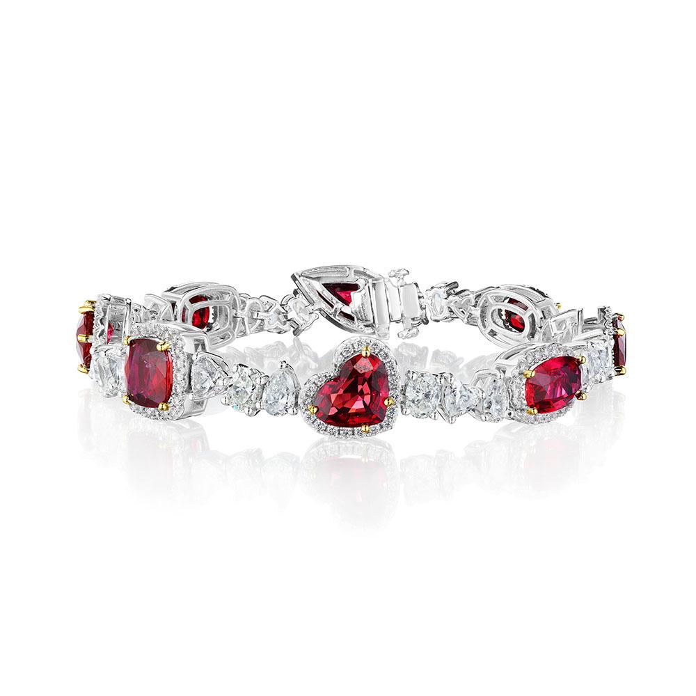 •	18KT White Gold
•	25.52 Carats
•	7” Long

•	Number of Rubies: 8
•	Carat Weight: 16.57ctw
•	Stone Cuts: Cushion, Pear, Oval, Heart

•	Number of Mixed Shape Diamonds: 26
•	Carat Weight: 7.36ctw
•	Stone Cuts: Round, Oval, Heart, Pear

•	Number of