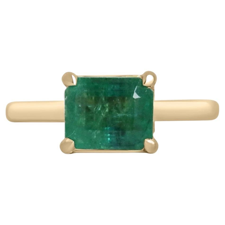2.55ct 18K East to West Emerald Cut Emerald Solitaire 4 Prong Gold Accent Ring For Sale