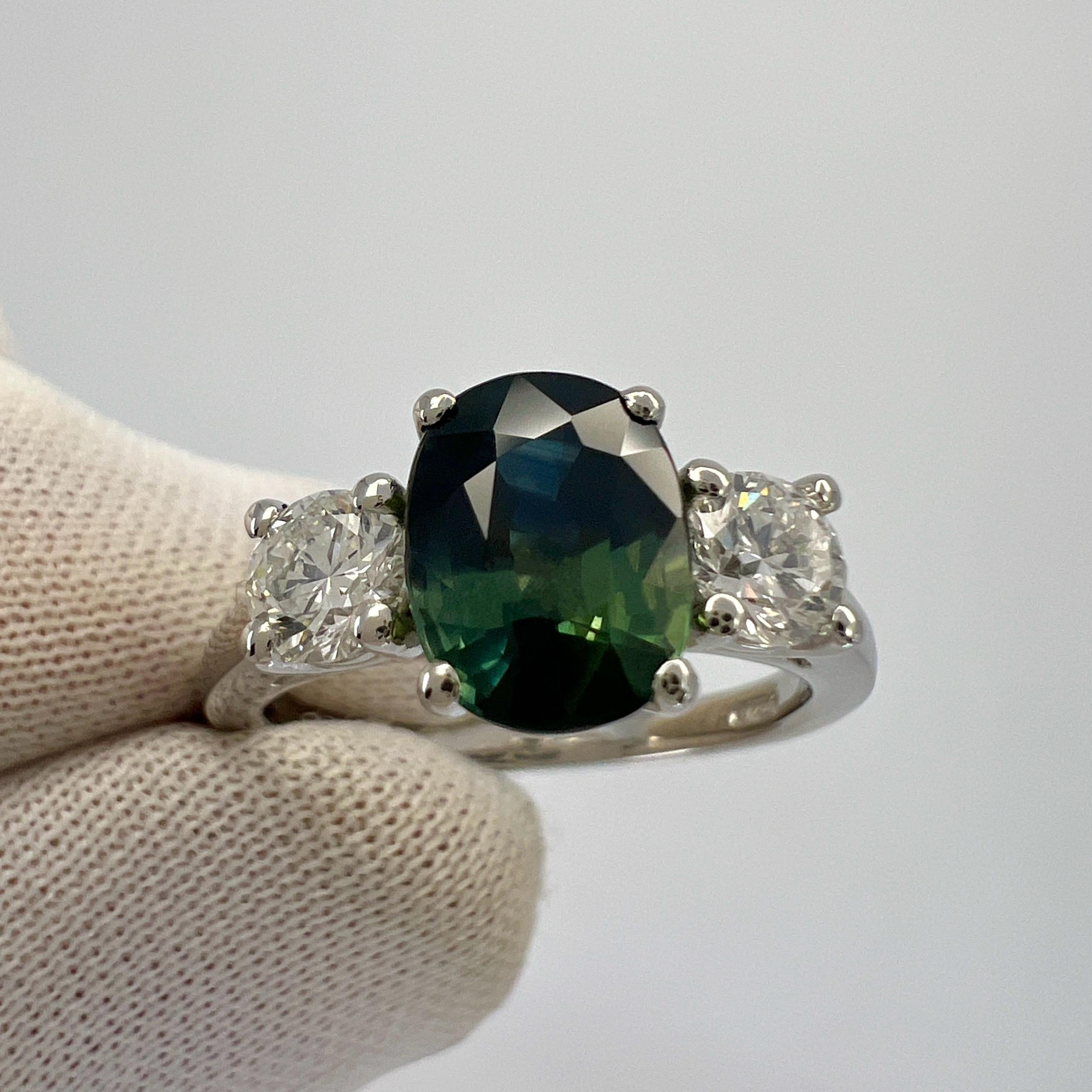 Oval Cut 2.55ct Deep Blue Green Bi Colour Sapphire & Diamond Platinum Three Stone Ring For Sale