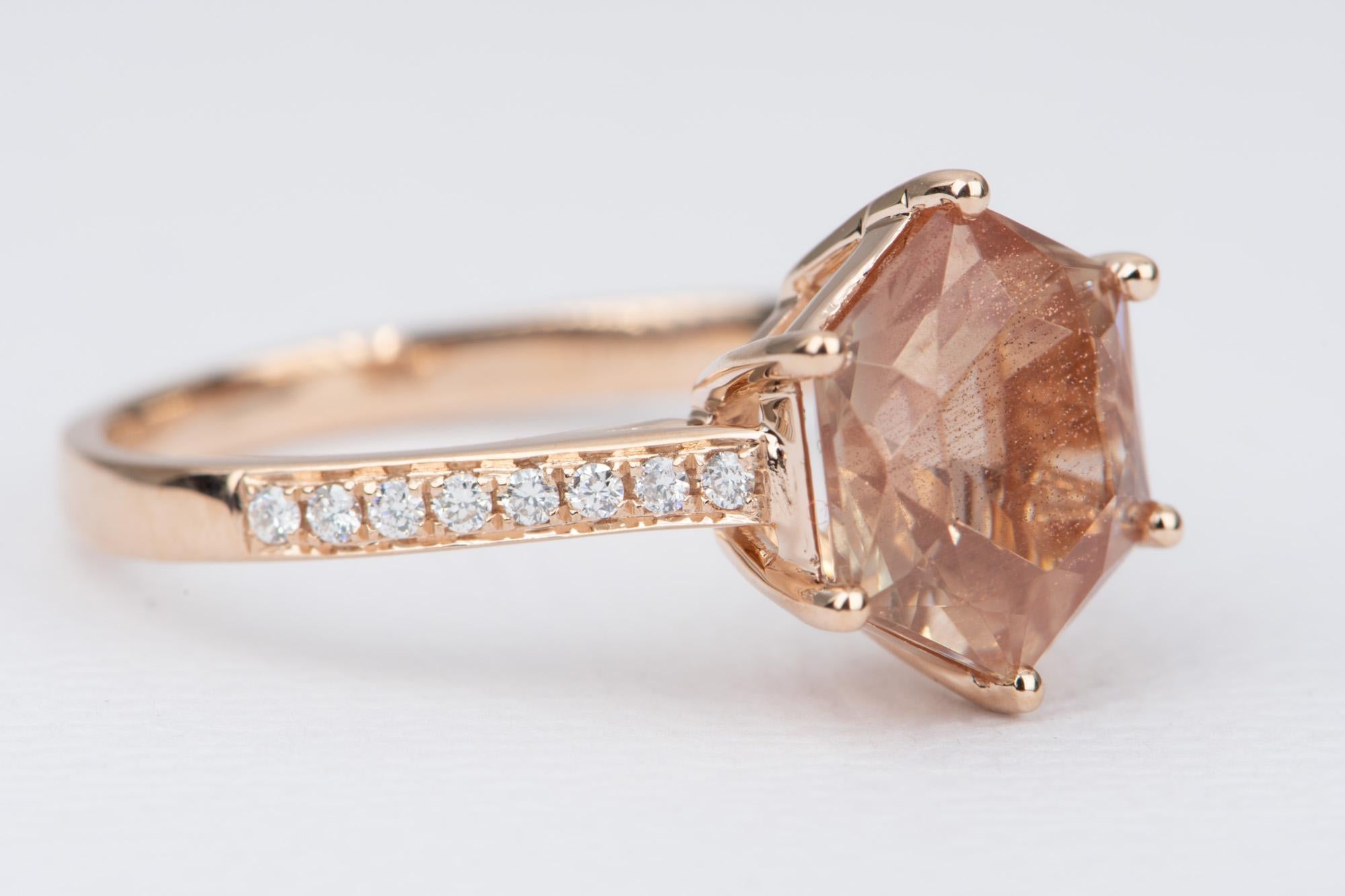 ♥  Solid 14K rose gold ring set with a hexagon-shaped Oregon sunstone center, with a half eternity diamond pave band
♥  The overall setting measures 9.9mm wide, 11.3 in length, and sits 6.8mm tall from the finger

♥  Ring size: US Size 7 (Free